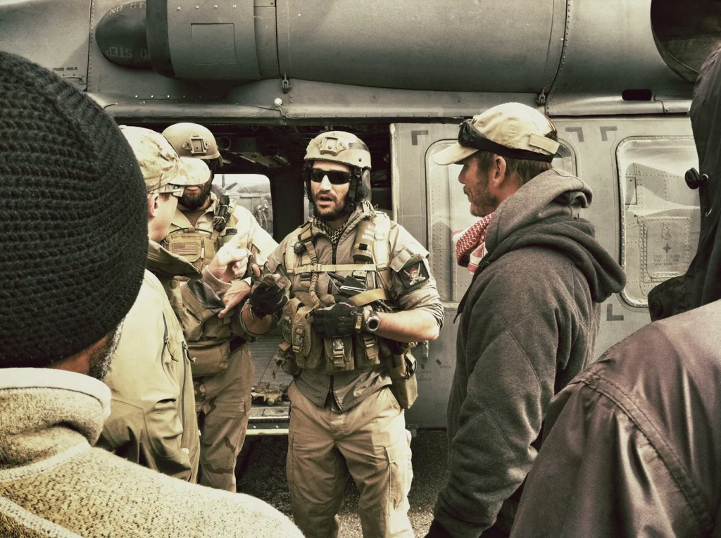 Photo: Mark Semos, center, advises director Pete Berg and crew on the set of Lone Survivor