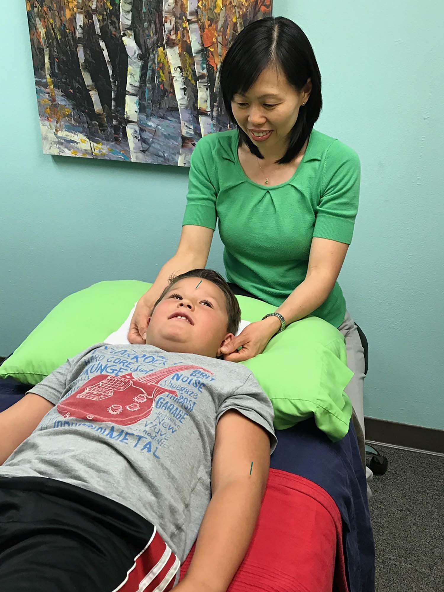 Dr. Iong Performing Acupuncture on a Child