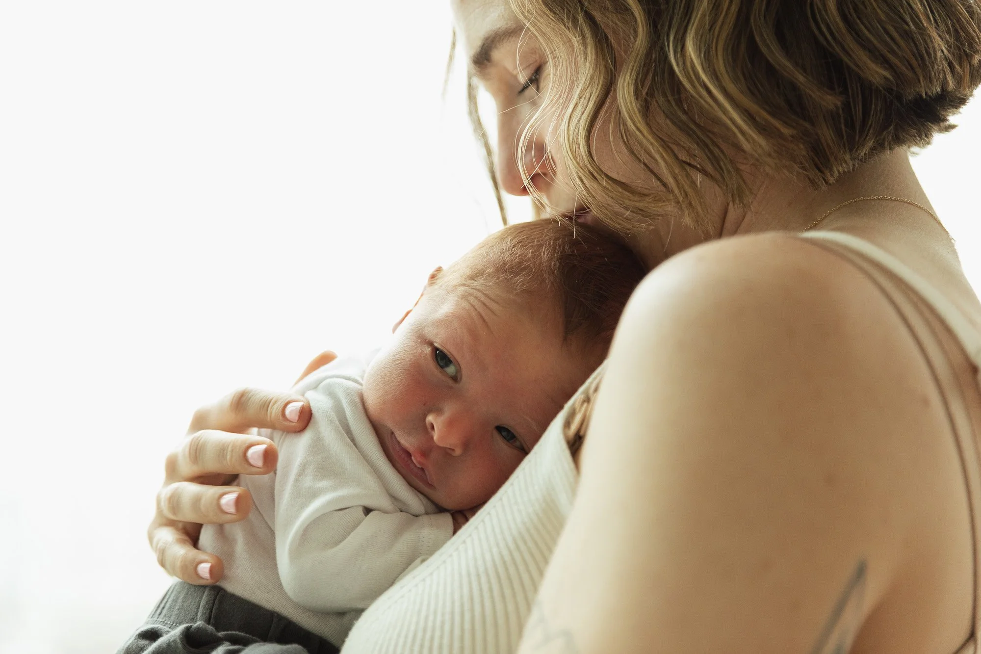 Baby boy in mom's arm