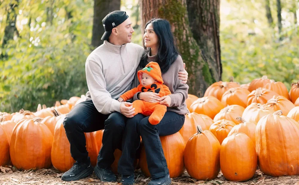 Sweet moment between couple with thier baby pumpkin