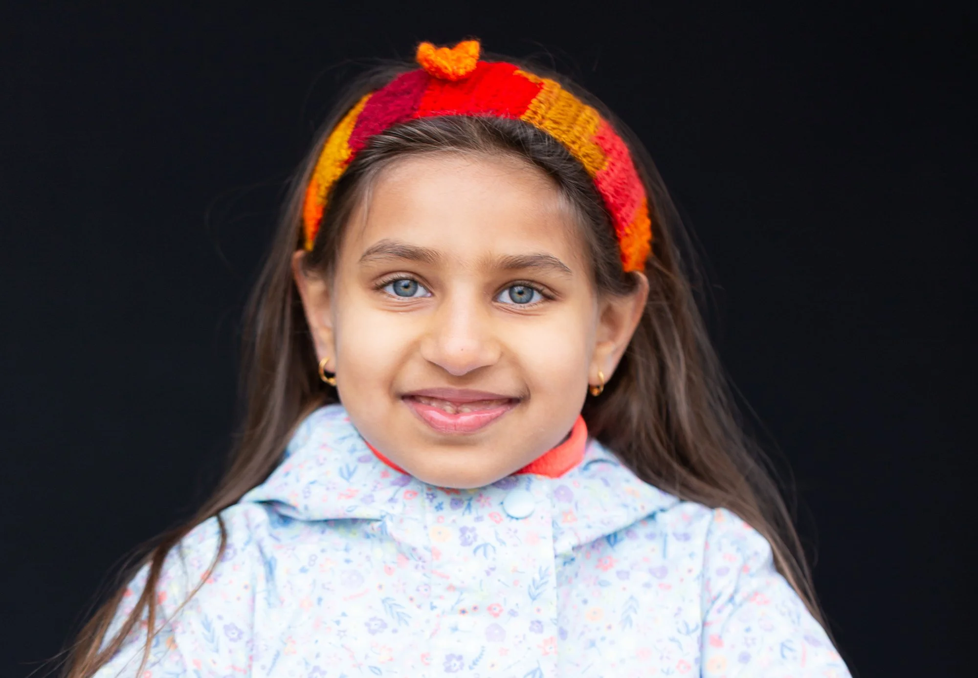 Natural school photo of child with genuine smile.