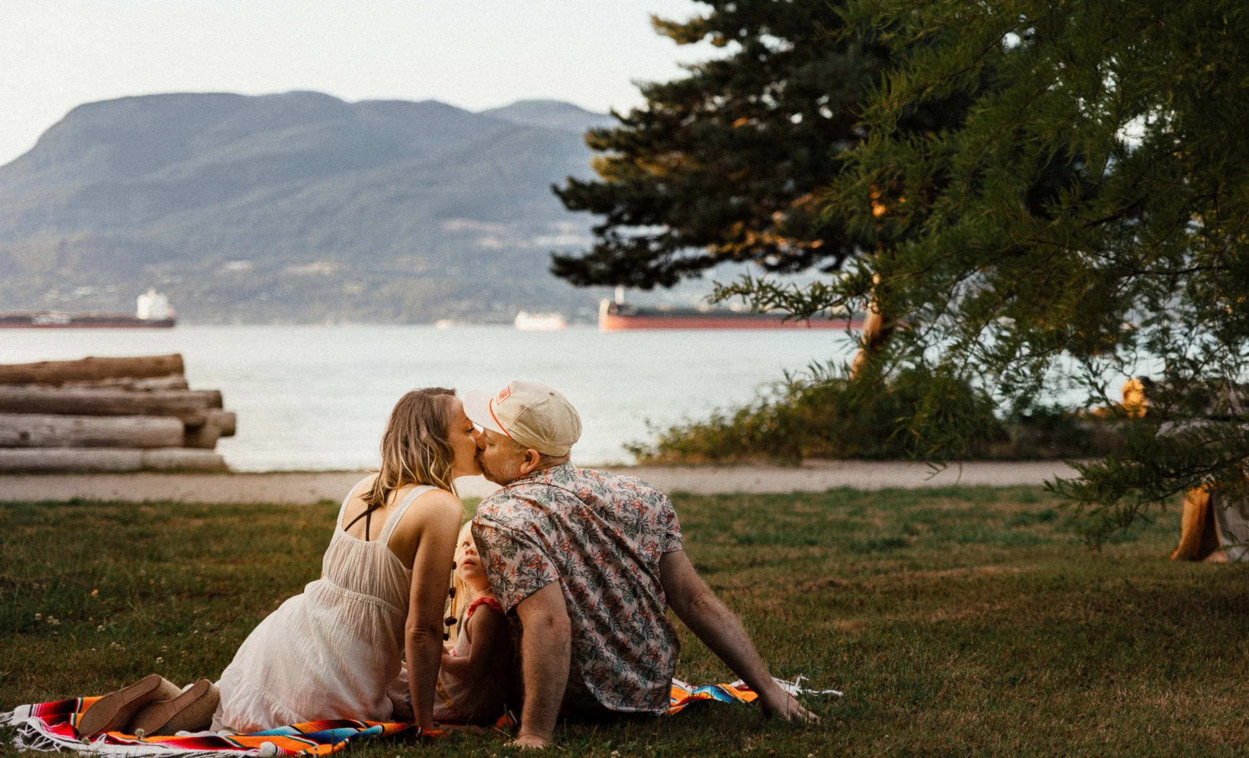 Mountains in the background and couples kissing