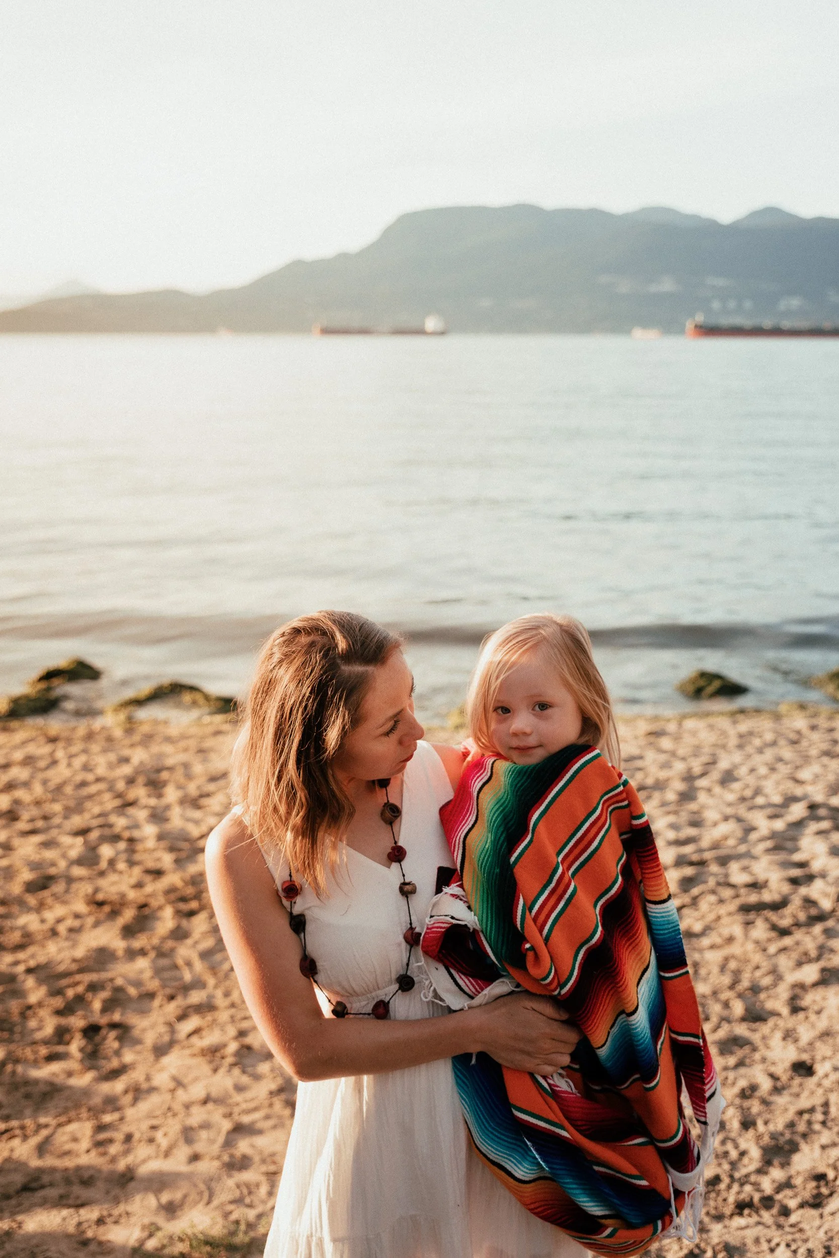 Cozying up on Vancouver beach, capture by Vancouver family photographer