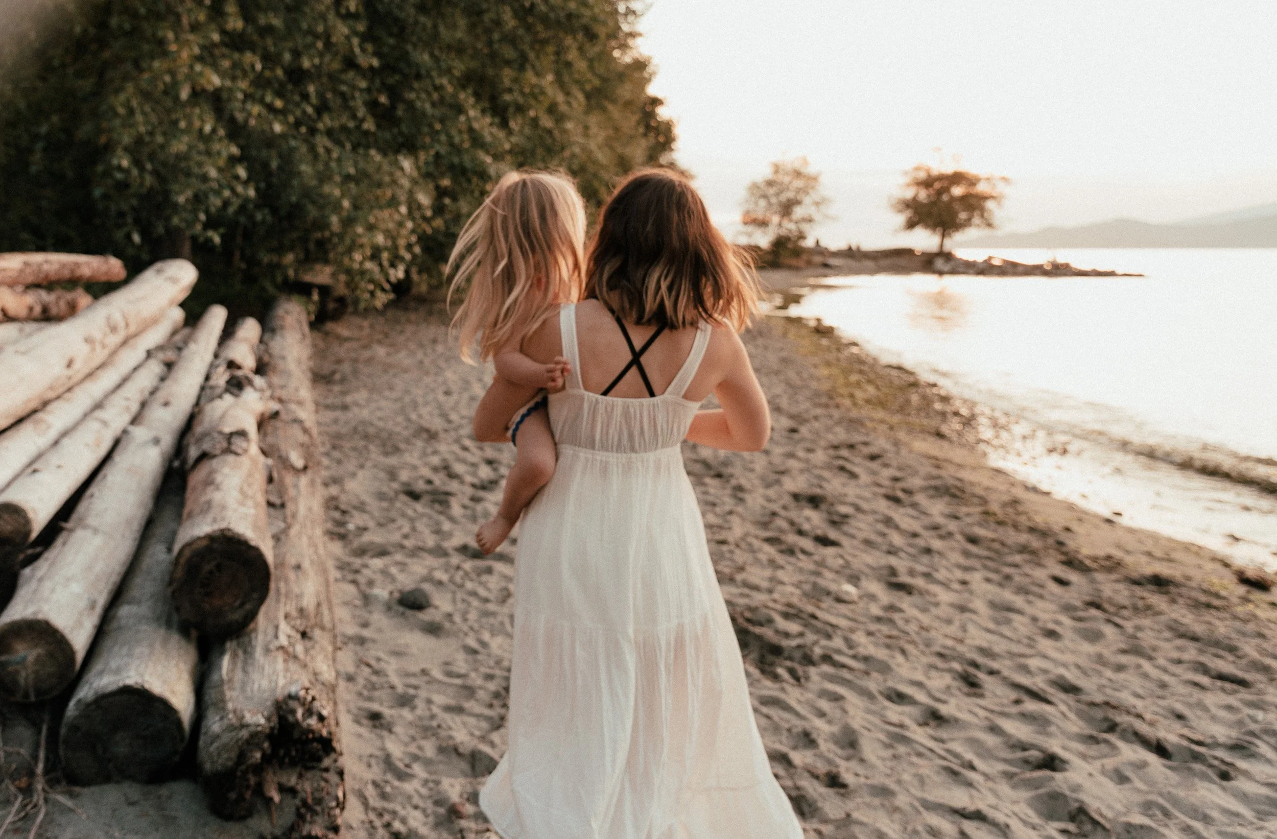 Mum and daughter on Spanish Banks Beach in Vancouver