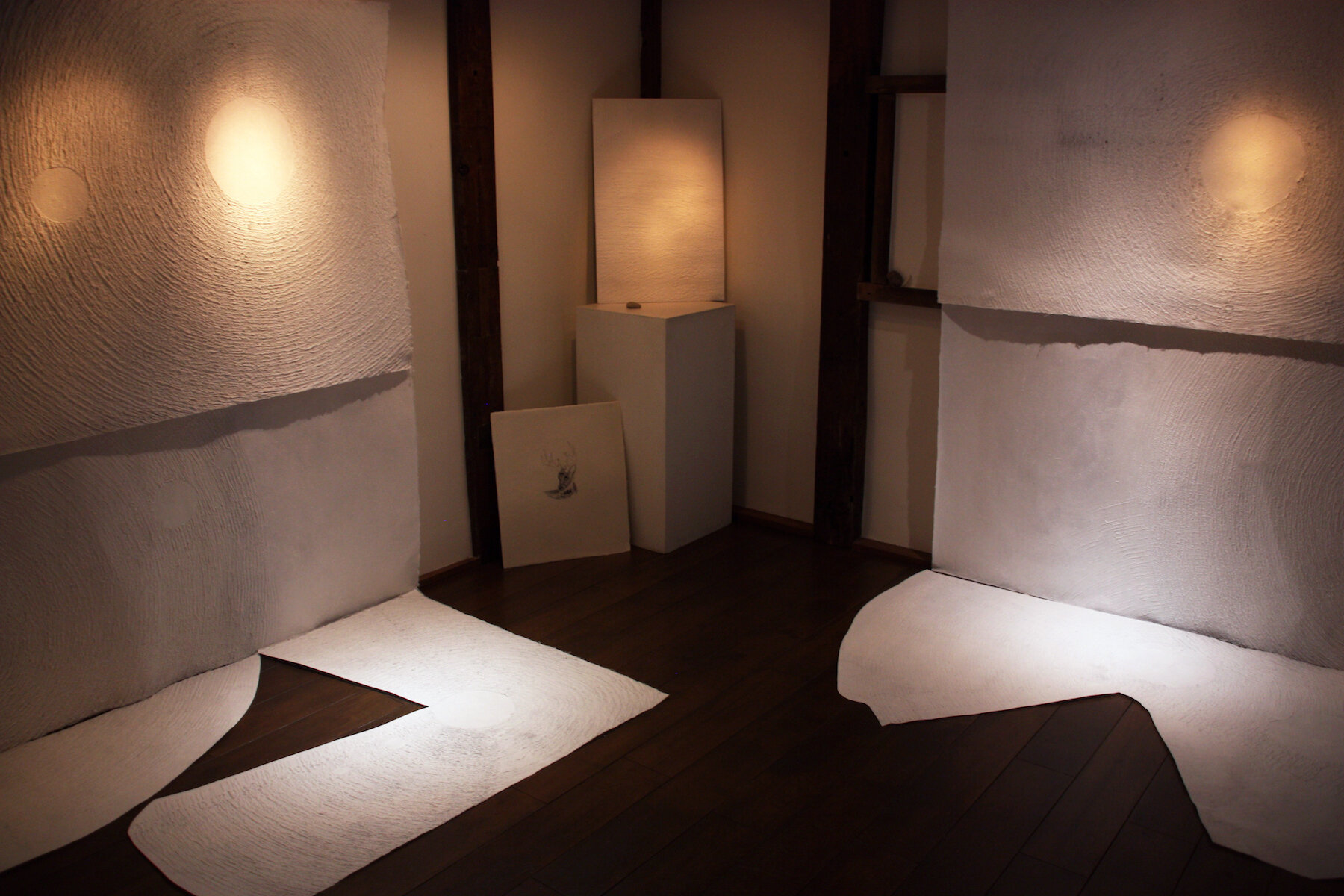    cavern of stars  , 2019 exhibition view (right)  handmade paper (kozo, mitsumata), sumi, LED  Gallery Yugen, Kyoto, Japan (renovated storehouse) 