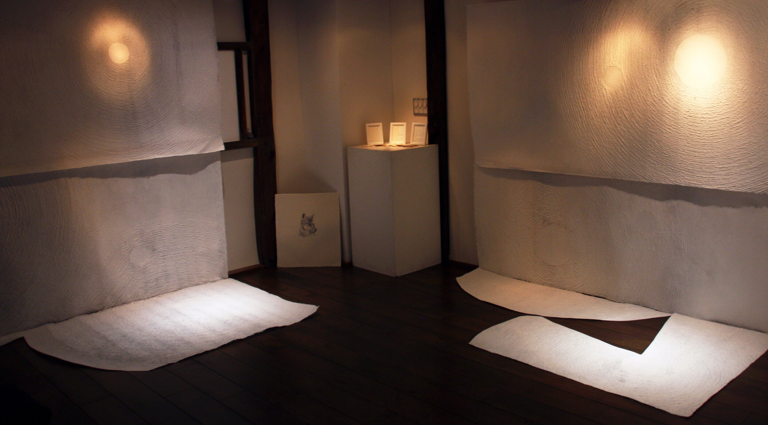    cavern of stars  , 2019 exhibition view (left)  handmade paper (kozo, mitsumata), sumi, LED  Gallery Yugen, Kyoto, Japan (renovated storehouse) 