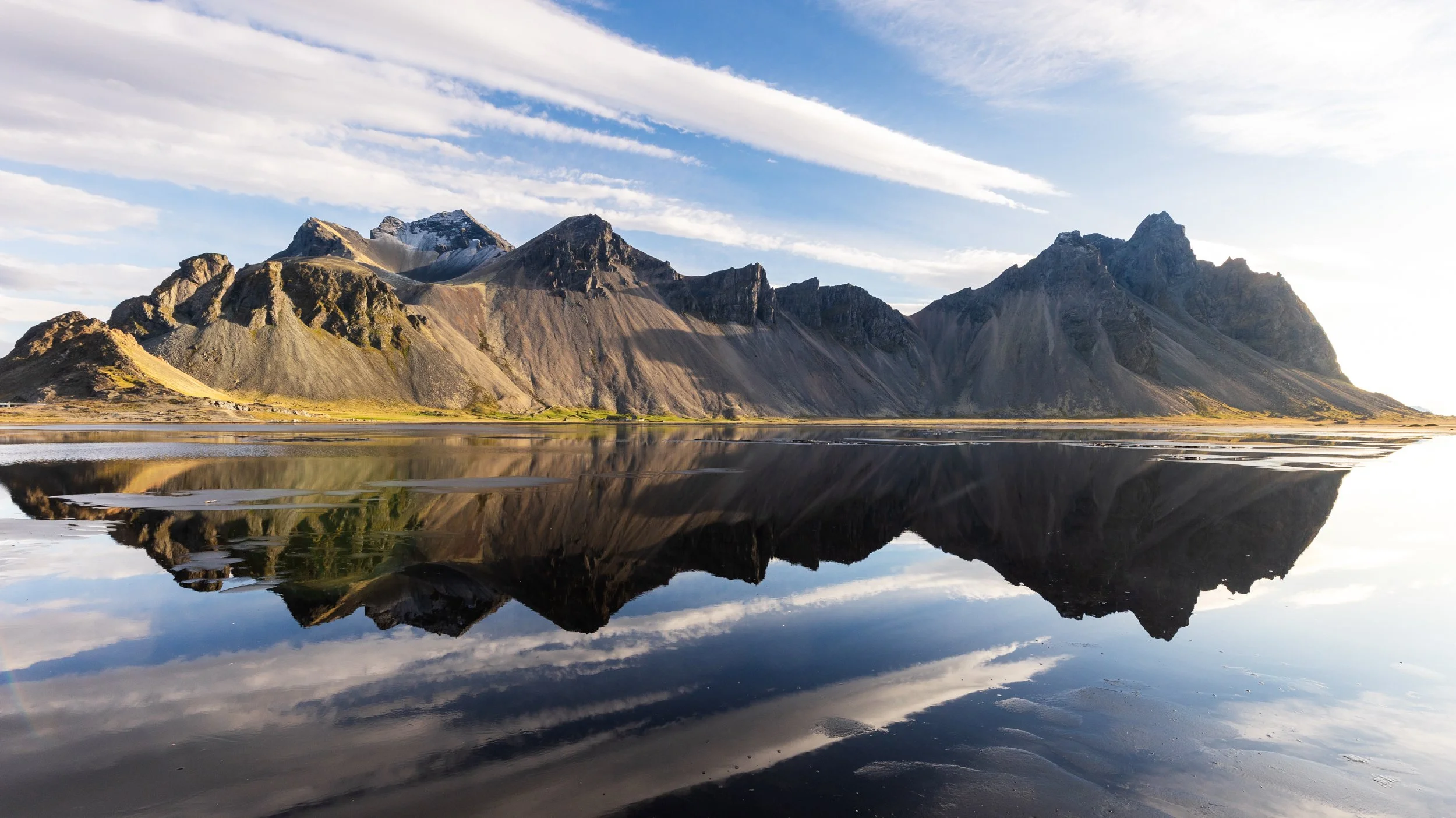 Reflections of Vestrahorn on Stokksnes beach.