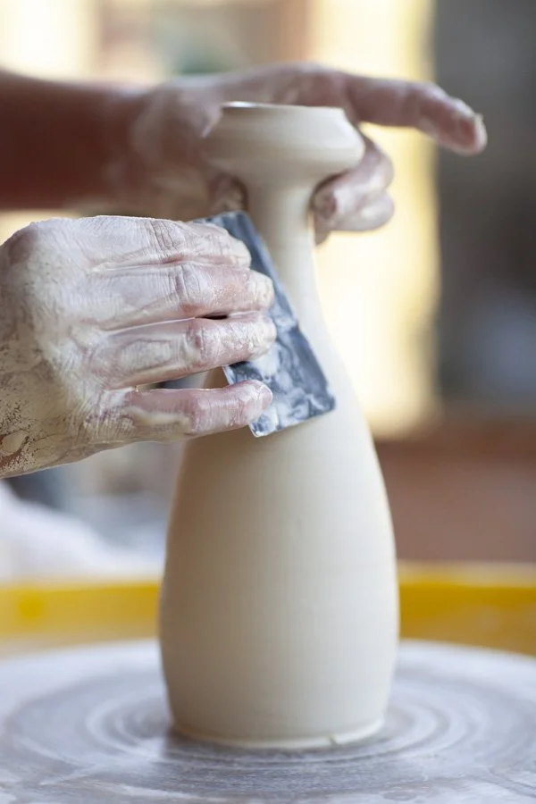 throwing a bottle on the wheel