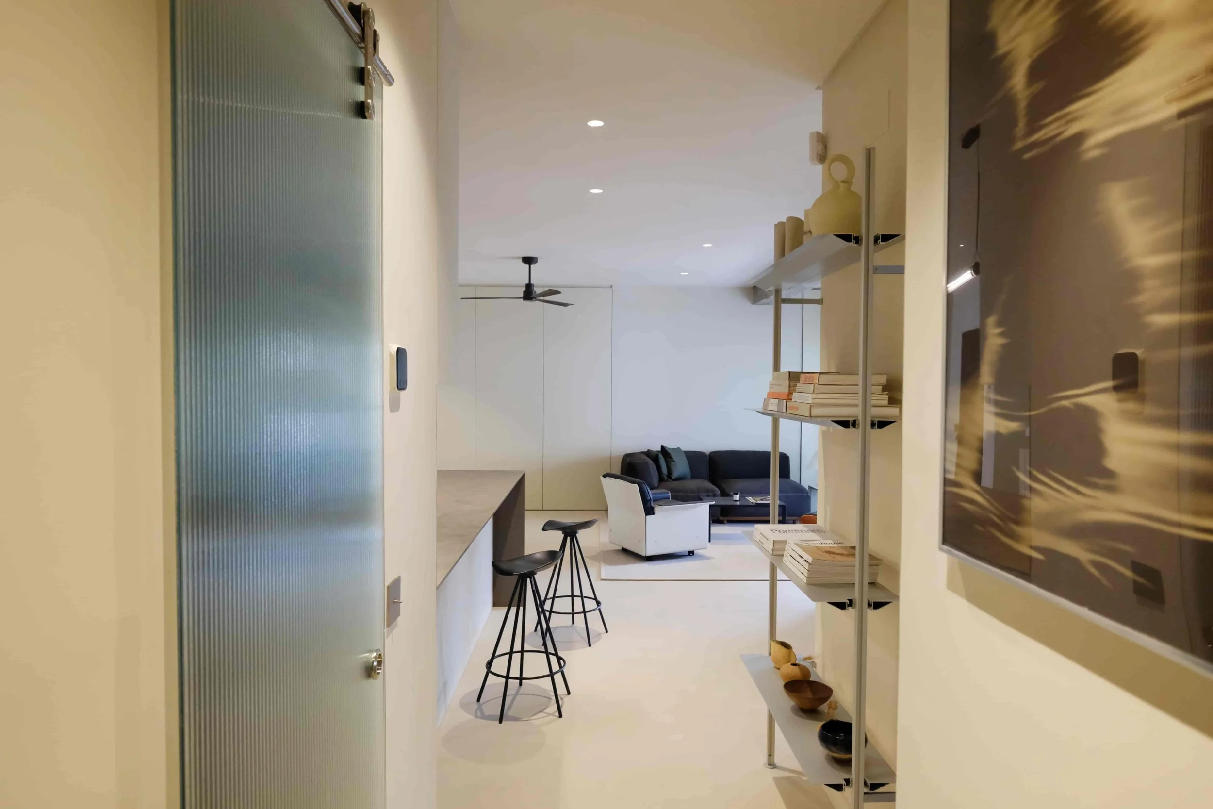 Casa Costa Barcelona healthy interiors retrofit passageway aluminium shelving andreu world sofa vitsoe chair