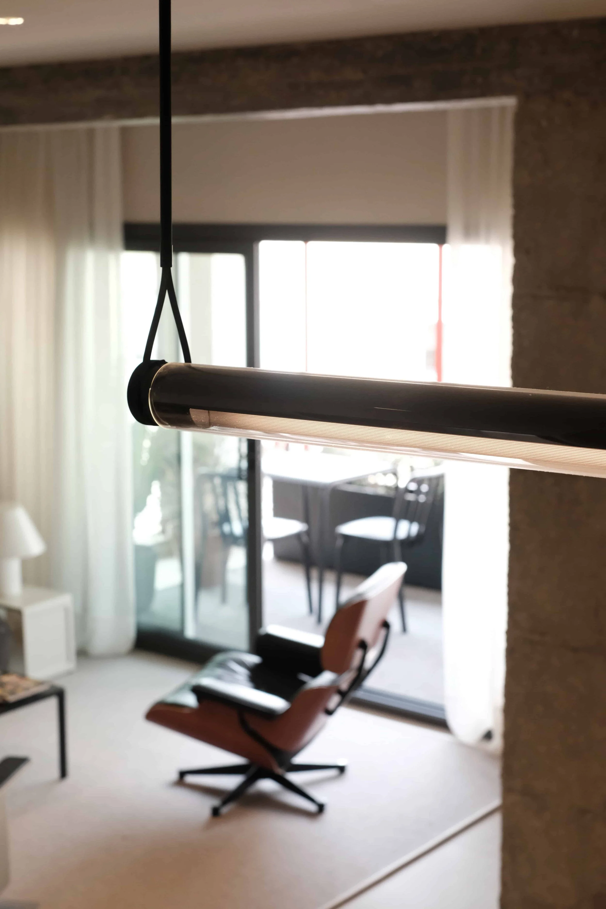 casa costa barcelona healthy interiors with marset lighting and eames lounge chair on a cotlin raw rug
