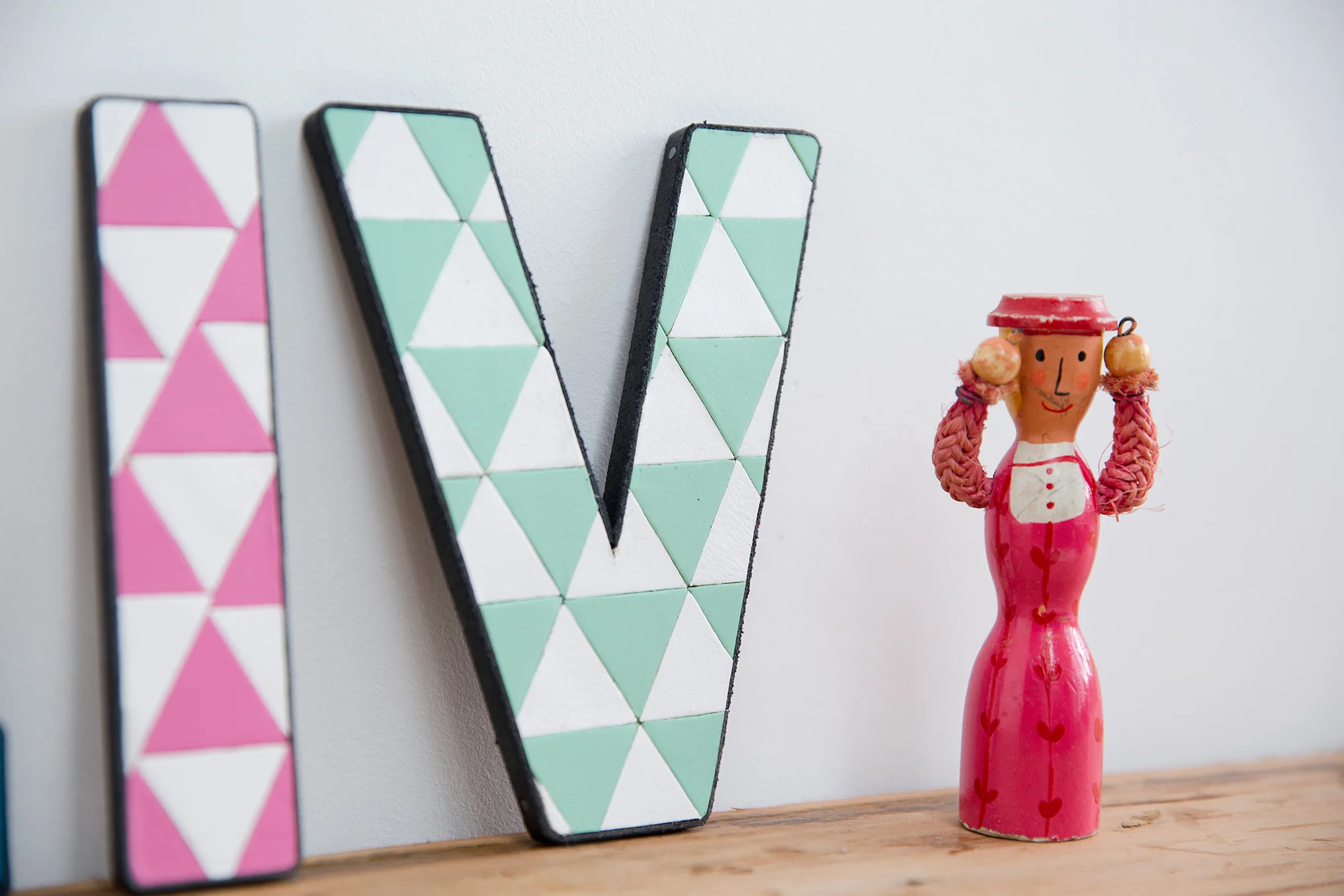 pink green triangles mosaic letters leather