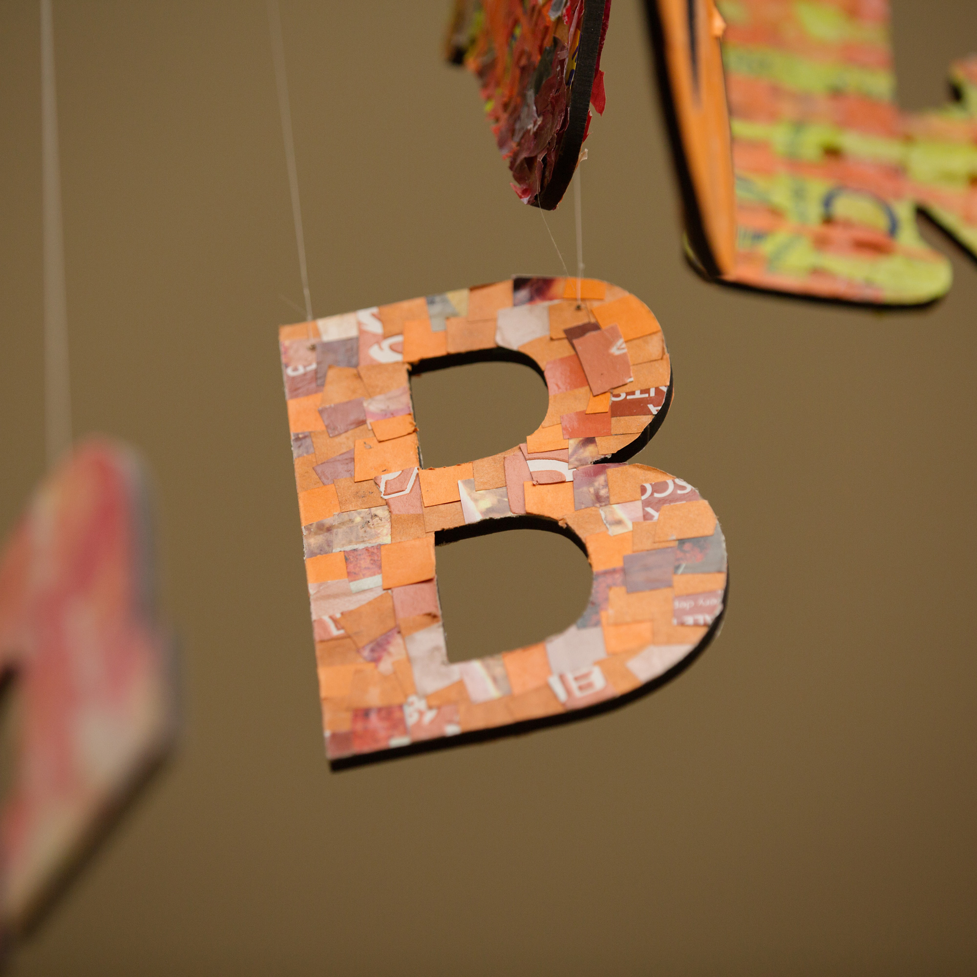 Letter B in art display made from woven plastics