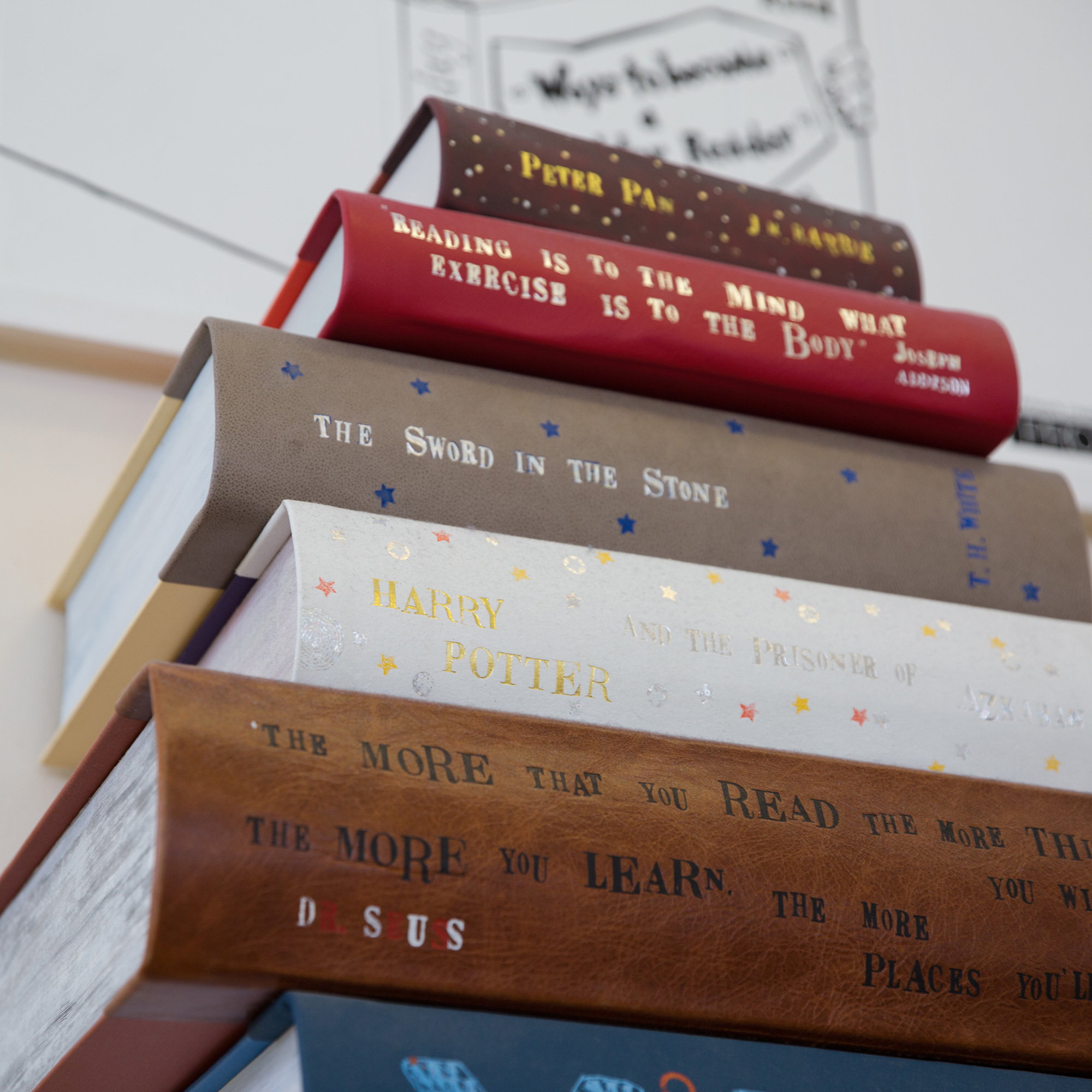 book spines hand embossed with gold foil showing book titles