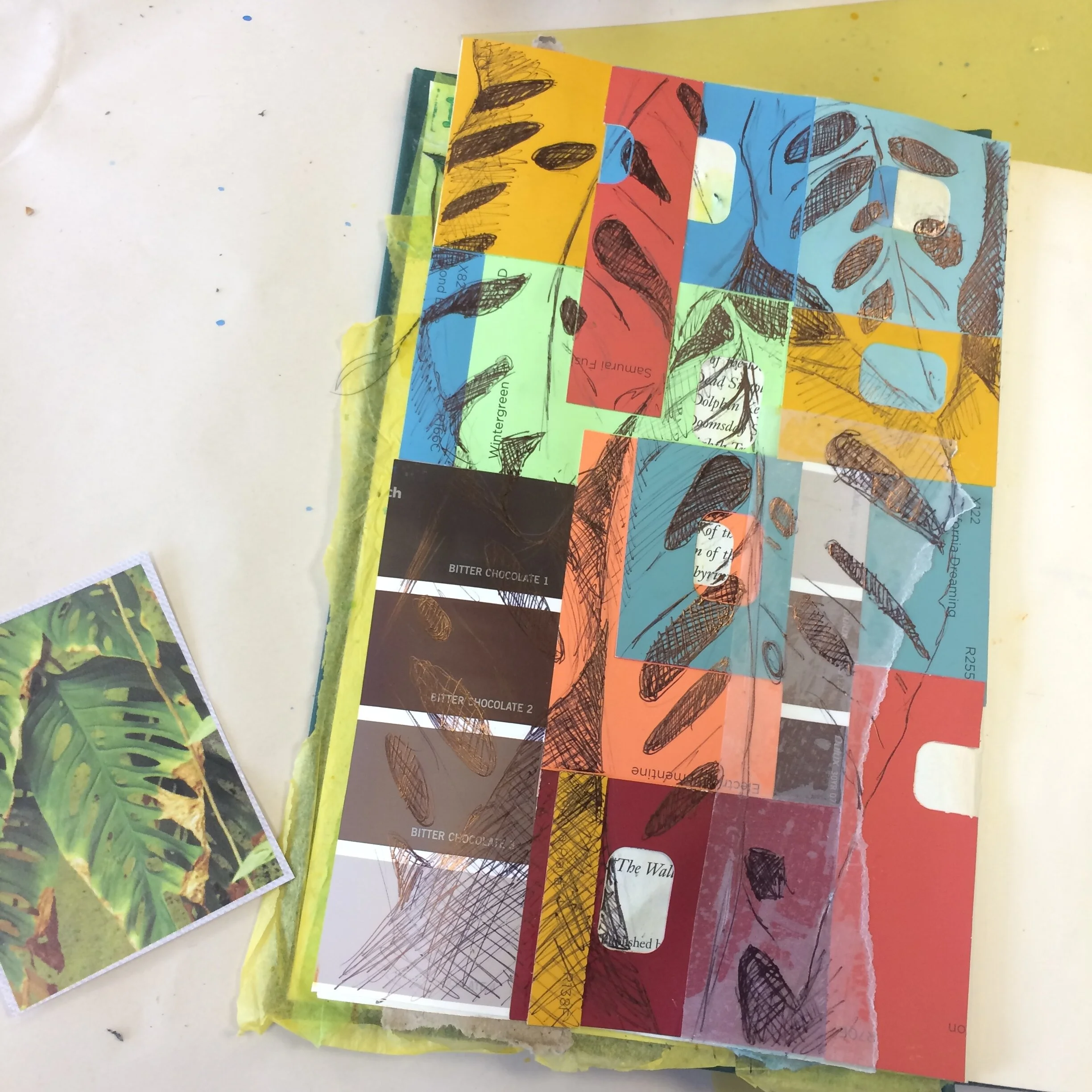 Leaf collage colour tabs samples on sketchbook page experiment