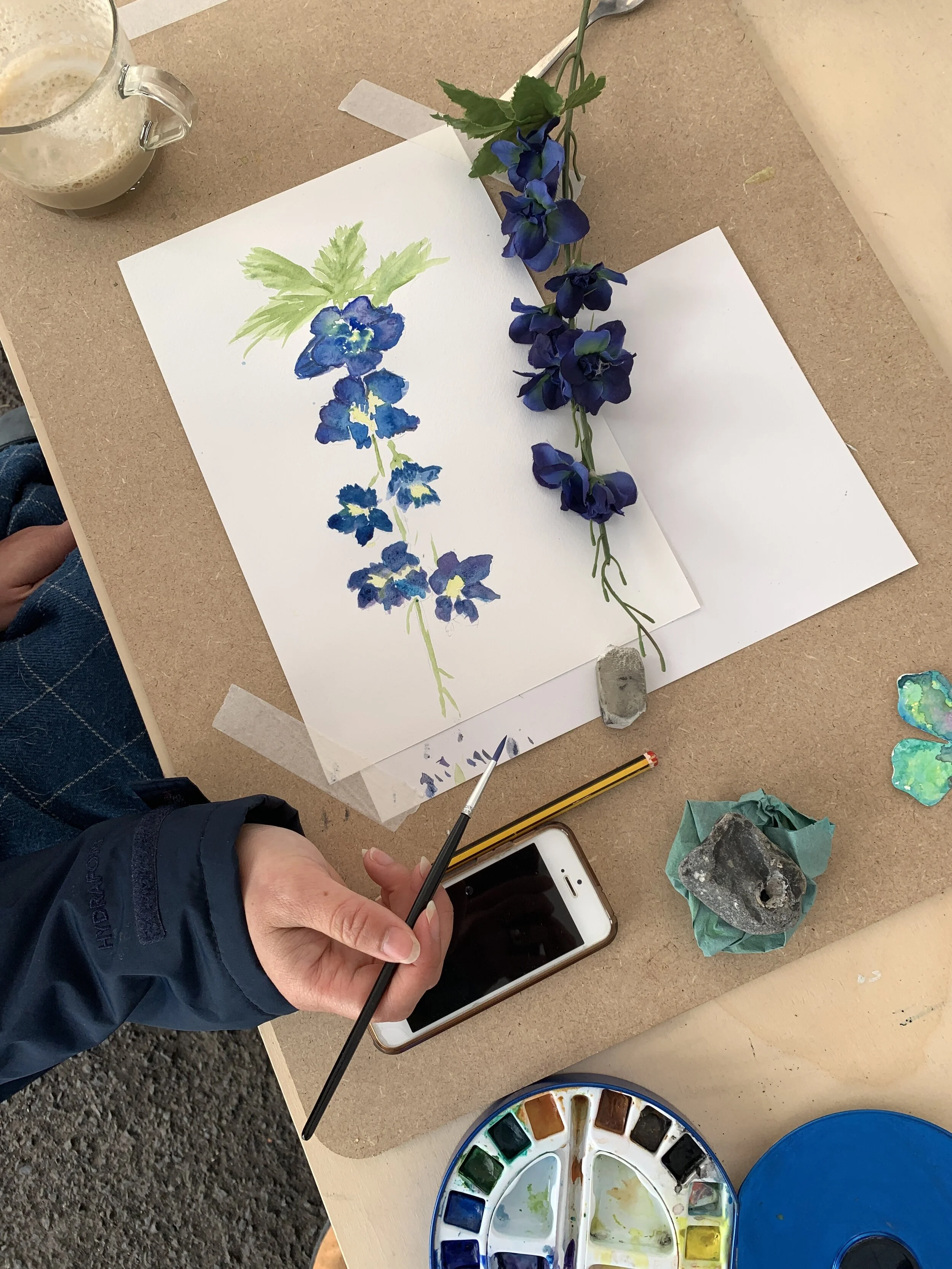 blue flower paining in watercolour class top view