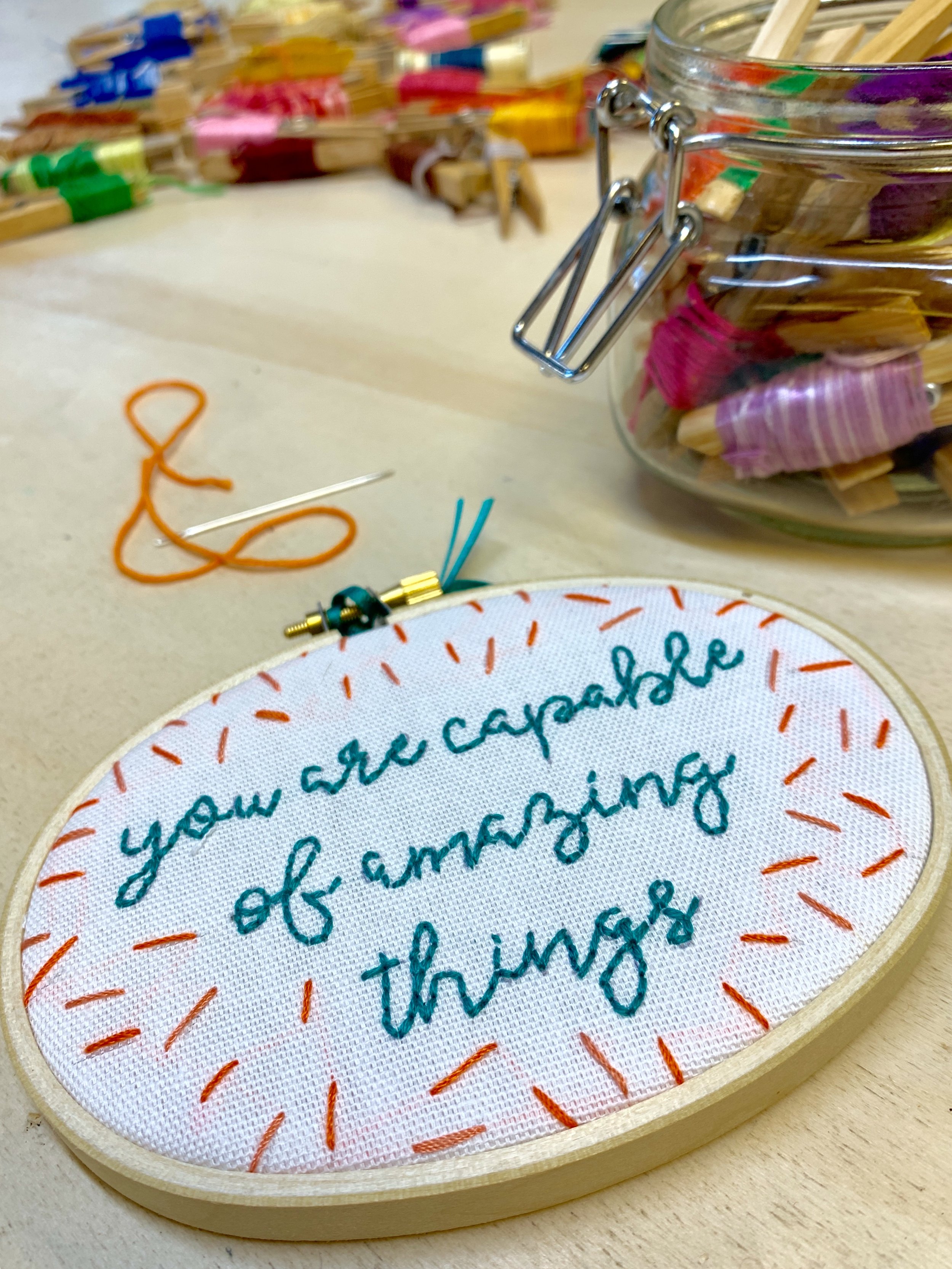happy embroidery class hand stitched embroidery art table with colourful floss hreads