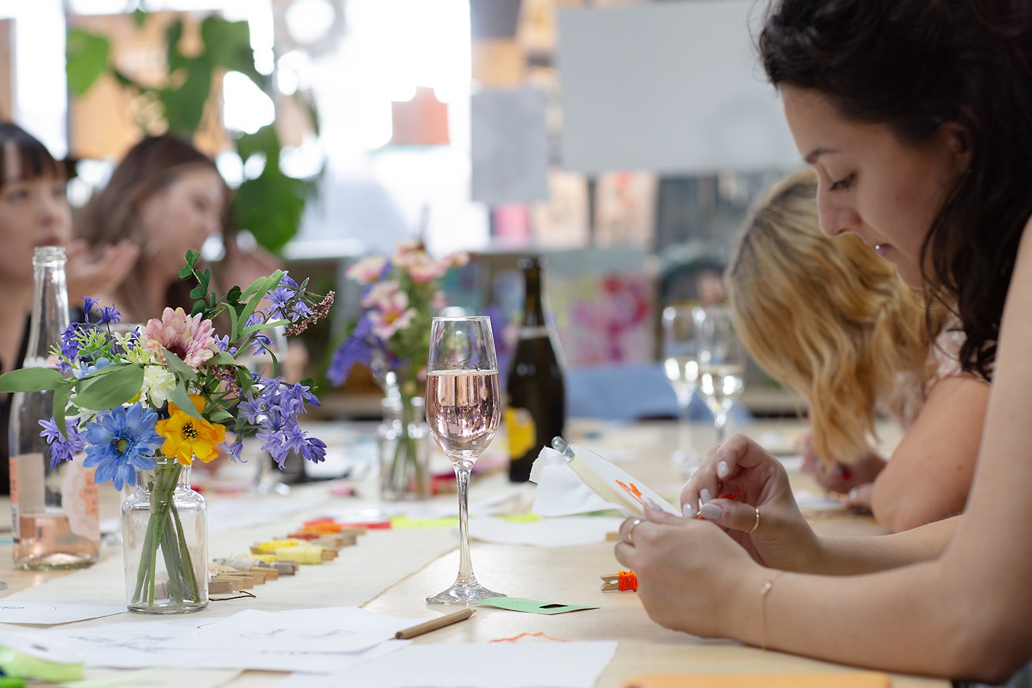women hand stitching embroidery in art party hen party flowers on decorative table fun friends stafford Proteanart
