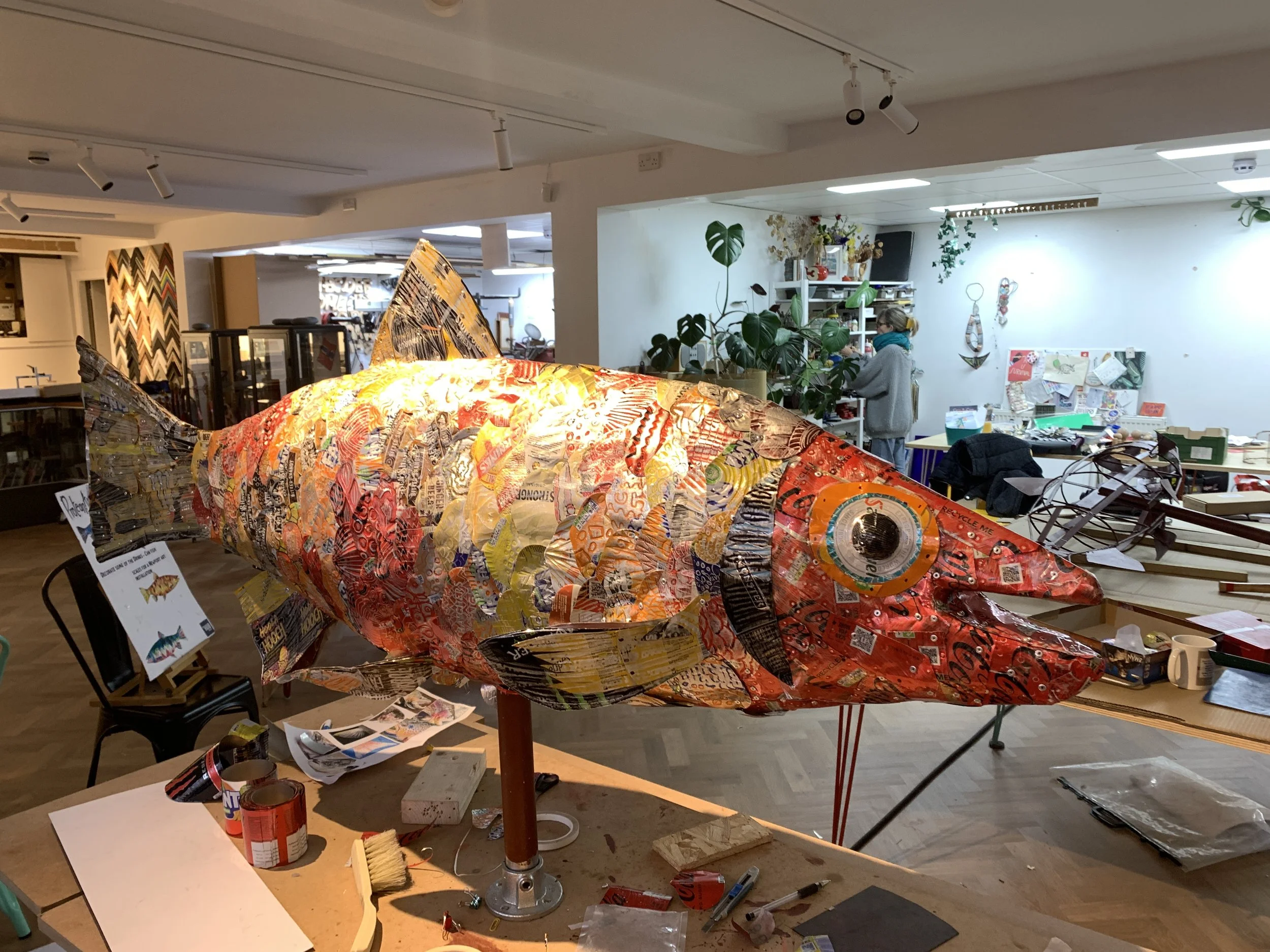 Metal fish sculpture in progress in studio