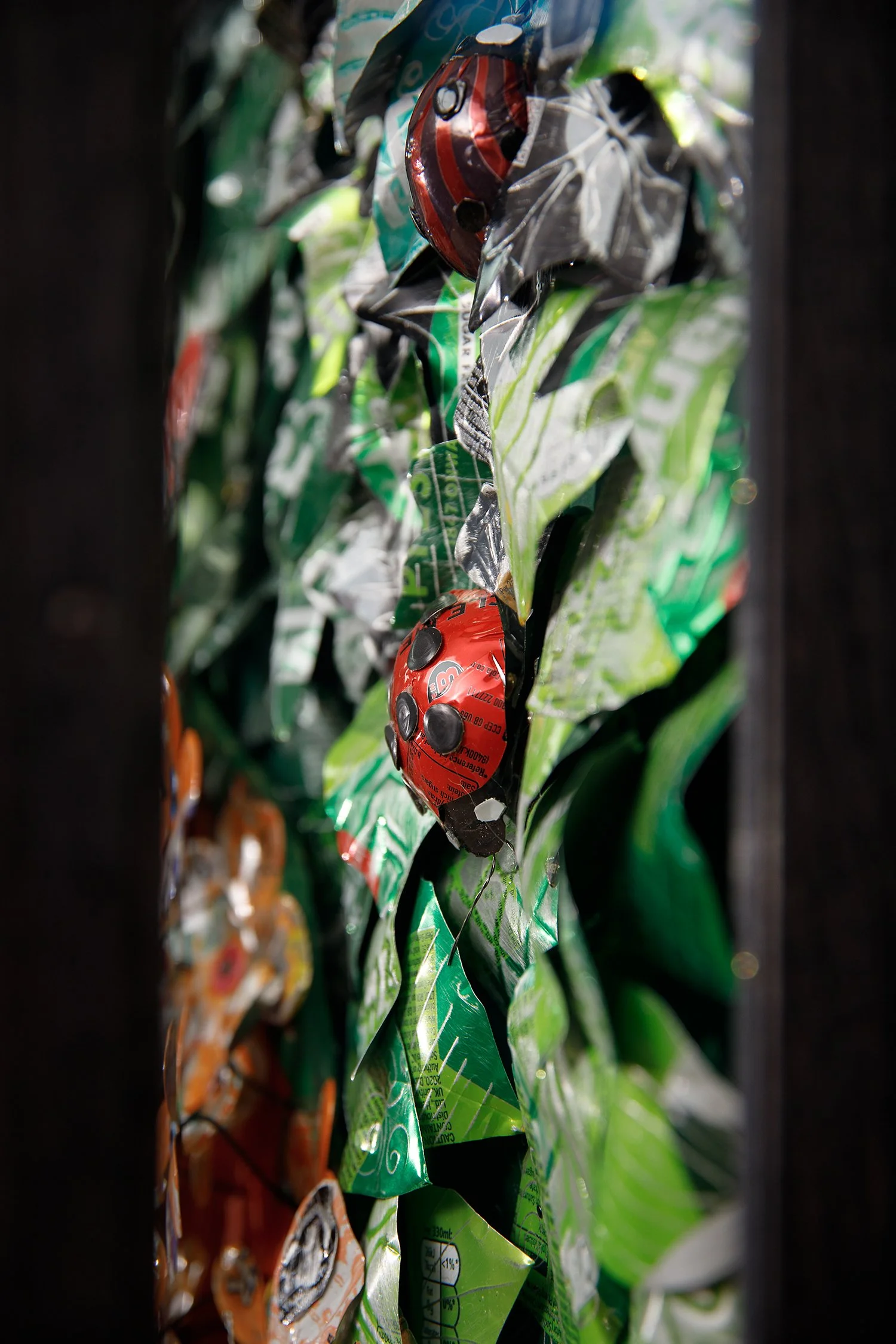 lady bird on green metal leaves.jpg