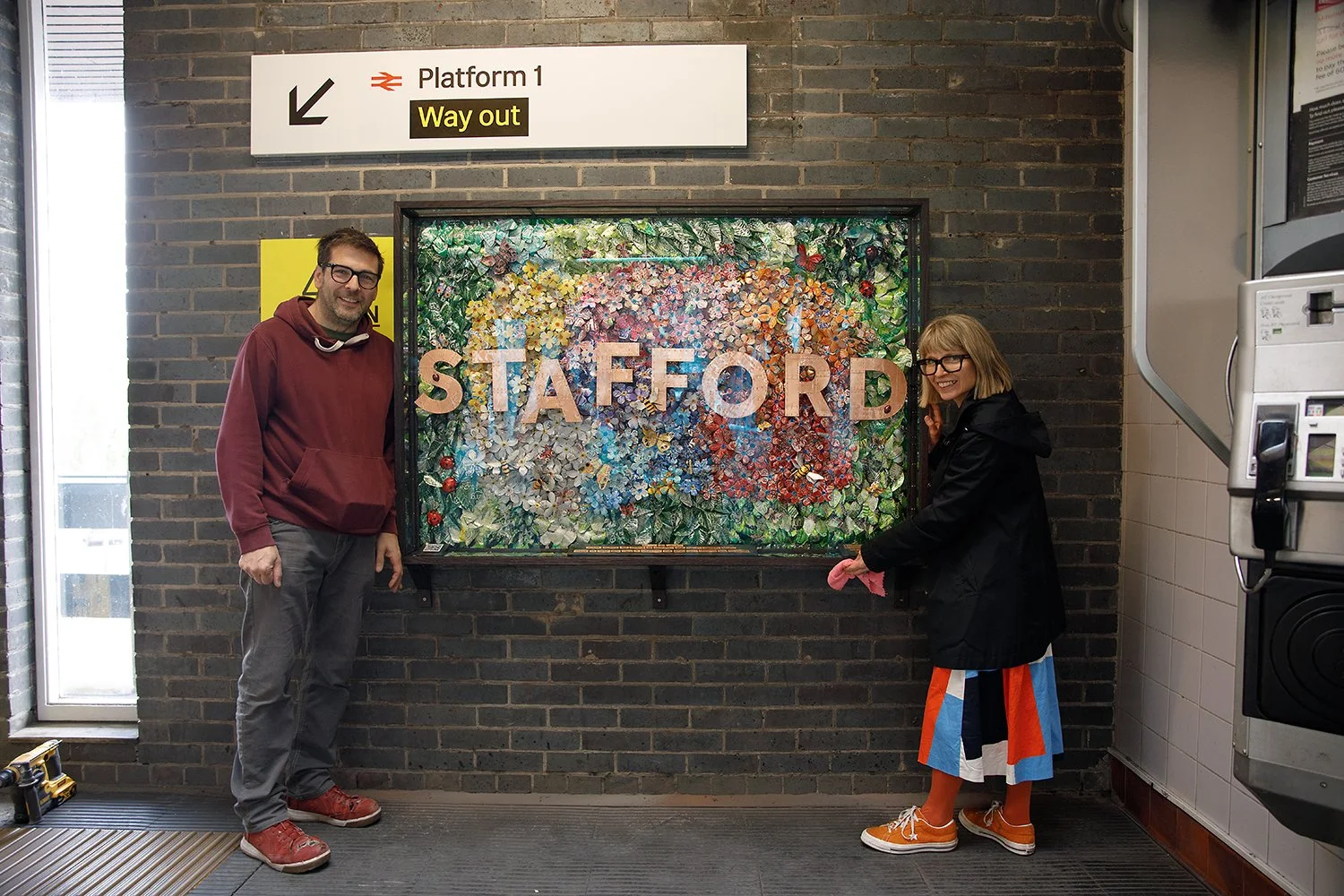 Proteanart john and Debbie with pollinator artwork.jpg