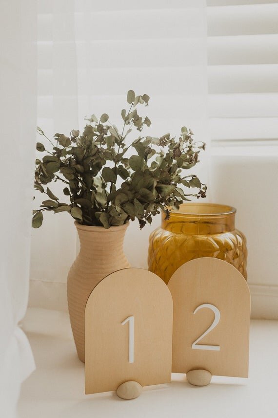 modern minimal arch table numbers for weddings or events