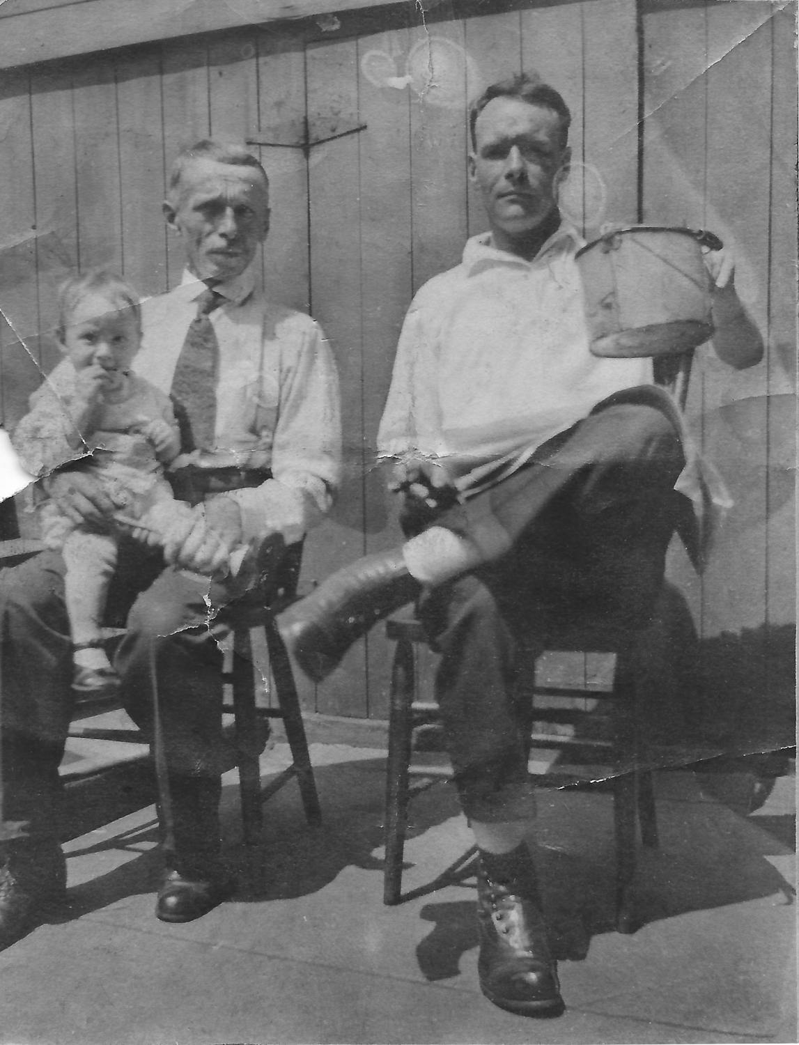 Herb, Grandpa Mossman, and Mike Mossman, holding a “beer can”