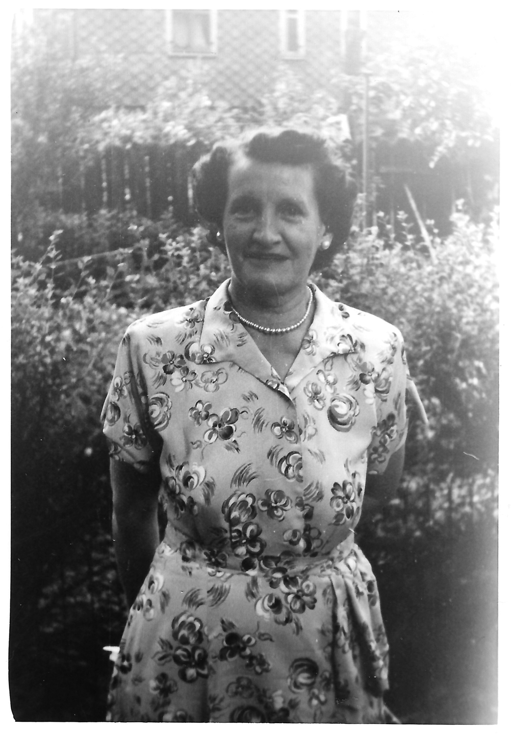 Mom in our backyard, around 1950