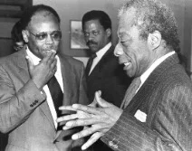 James Baldwin (right) with Washington Post columnist William Raspberry (left) and CNN news anchor Bernard Shaw (center), December 10, 1986. Photo by Stan Jennings. National Press Club Archives.