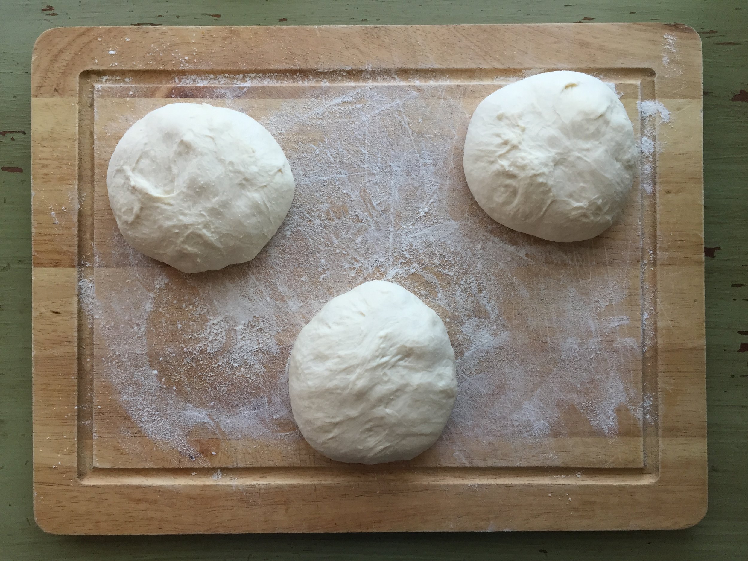  3 dough balls pre-shaped and resting while the oven heats up.  
