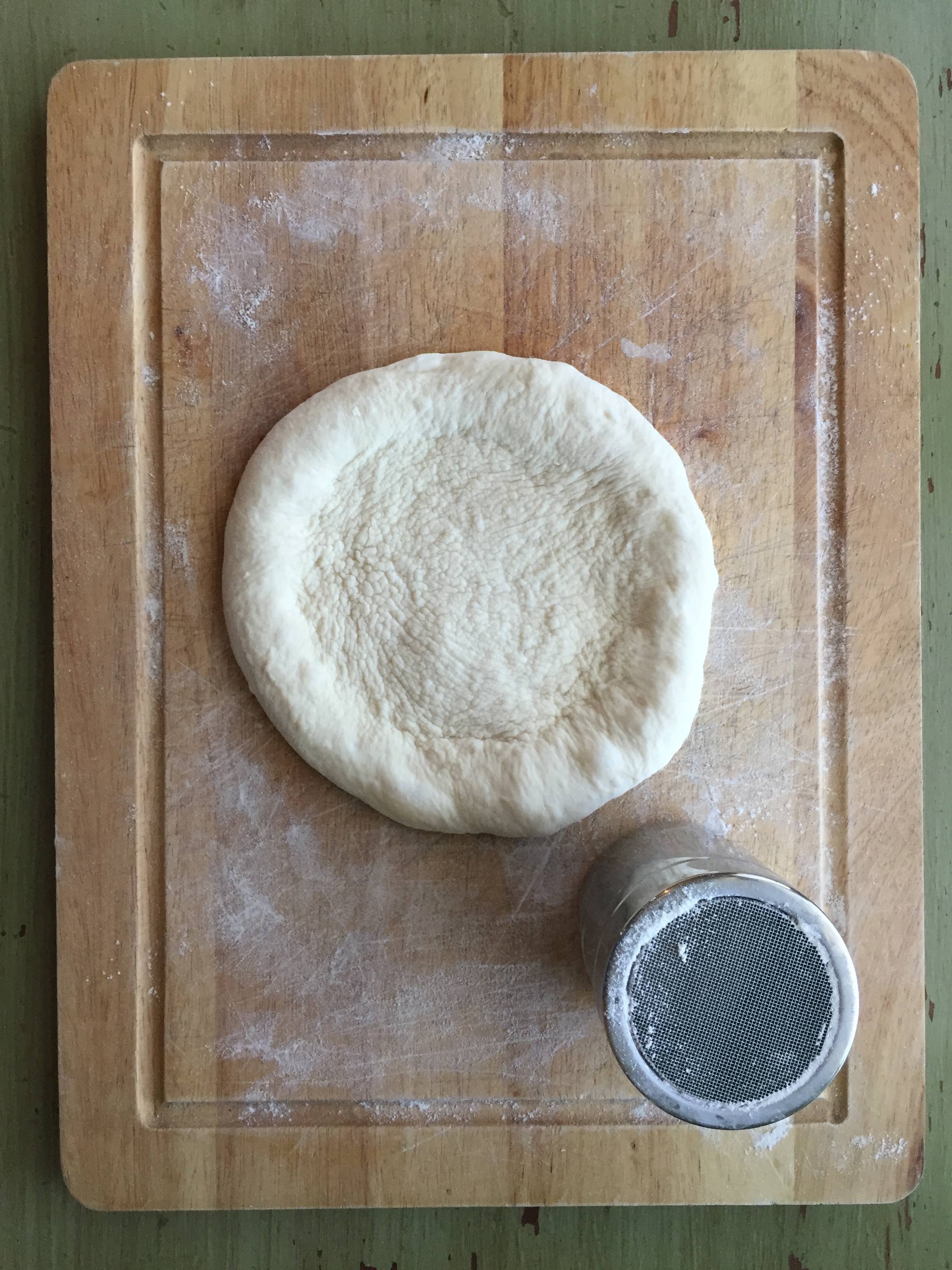  Shaped pizza dough ready for toppings! This dough will stretch out even more after after a few minutes rest.  