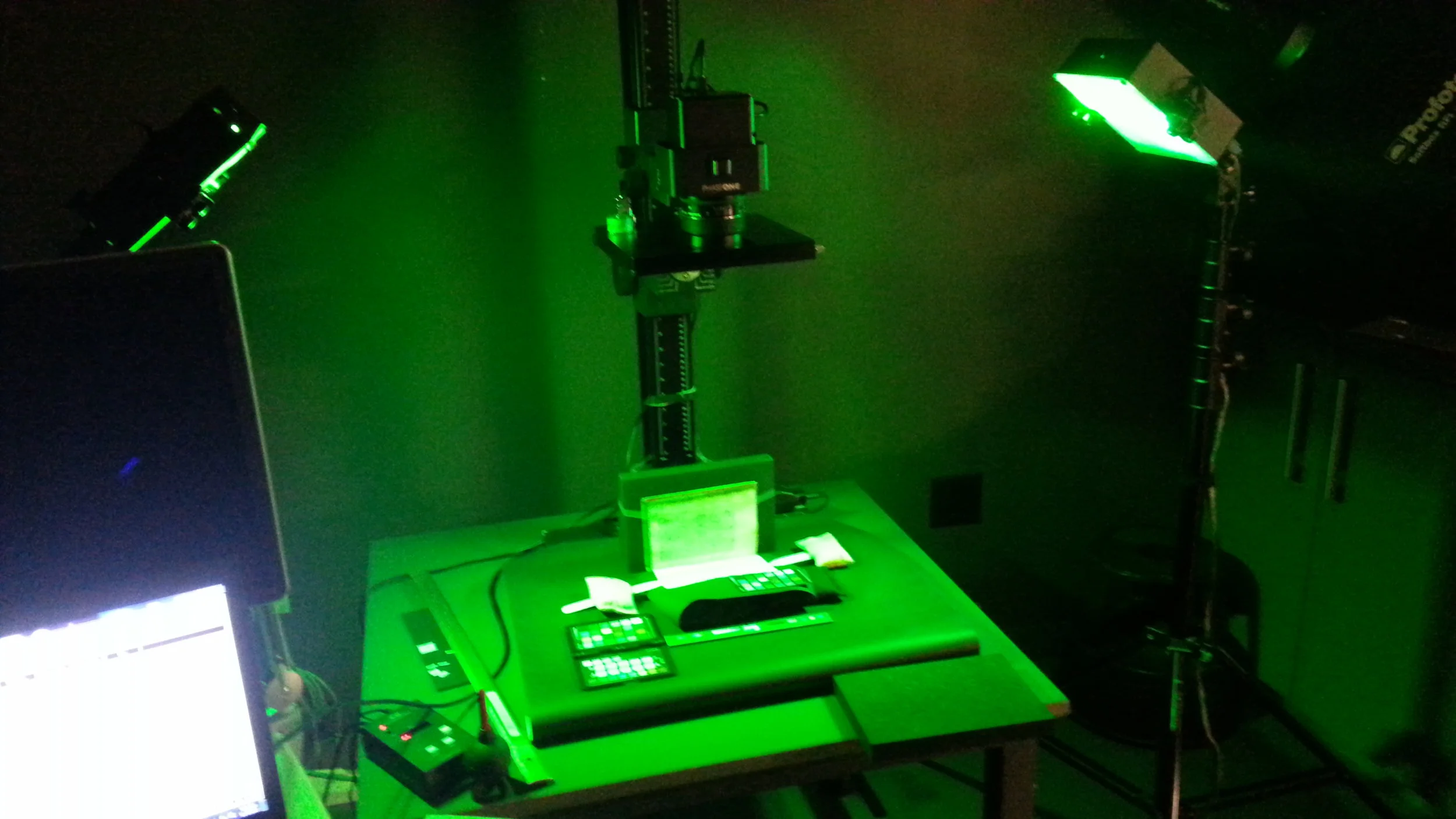 Multispectral imaging of a medieval manuscript—at this particular moment, with a wavelength that appears as green to the human eye. (Part of the Library of Stains imaging process.)