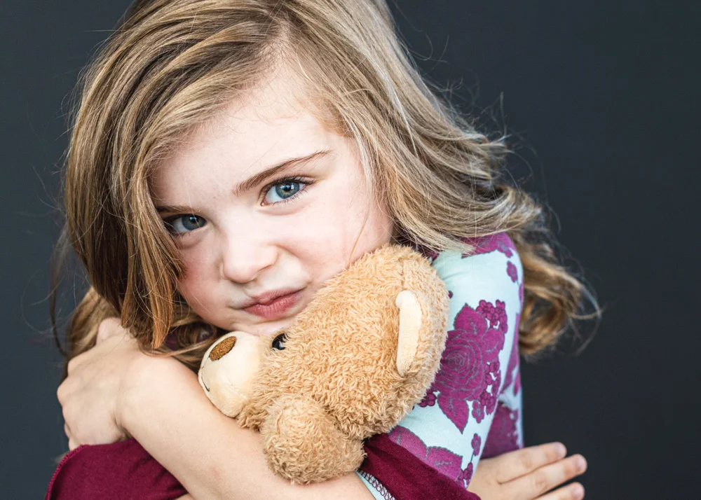 Children may bring a small prop to picture day. The prop must be something they can hold in their hands such as a sports ball, an instrument, a favorite book, a stuffed animal or a blankie. These things need to be stored in a child's backpack before and after their picture session.