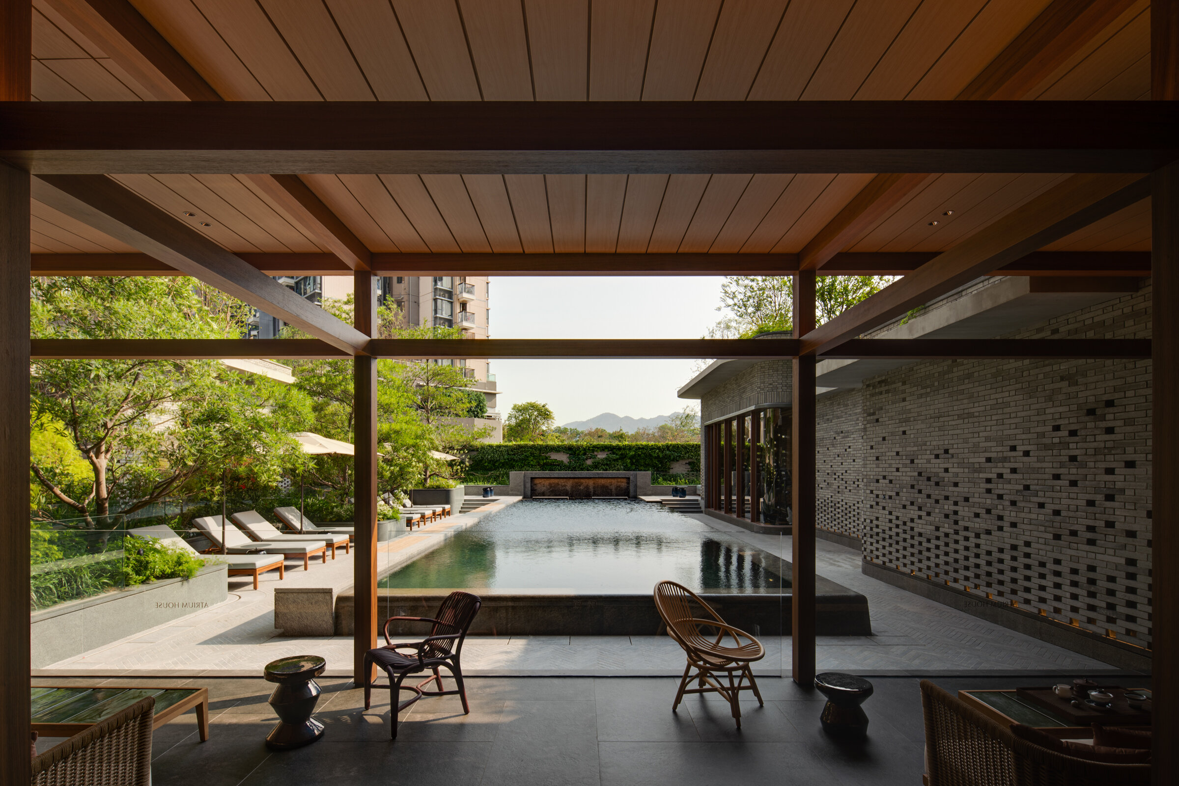  A peaceful clubhouse is the center of this new development in Yuen Long, Hong Kong. Atrium House is developed by New World Development, with clubhouse design by via.   