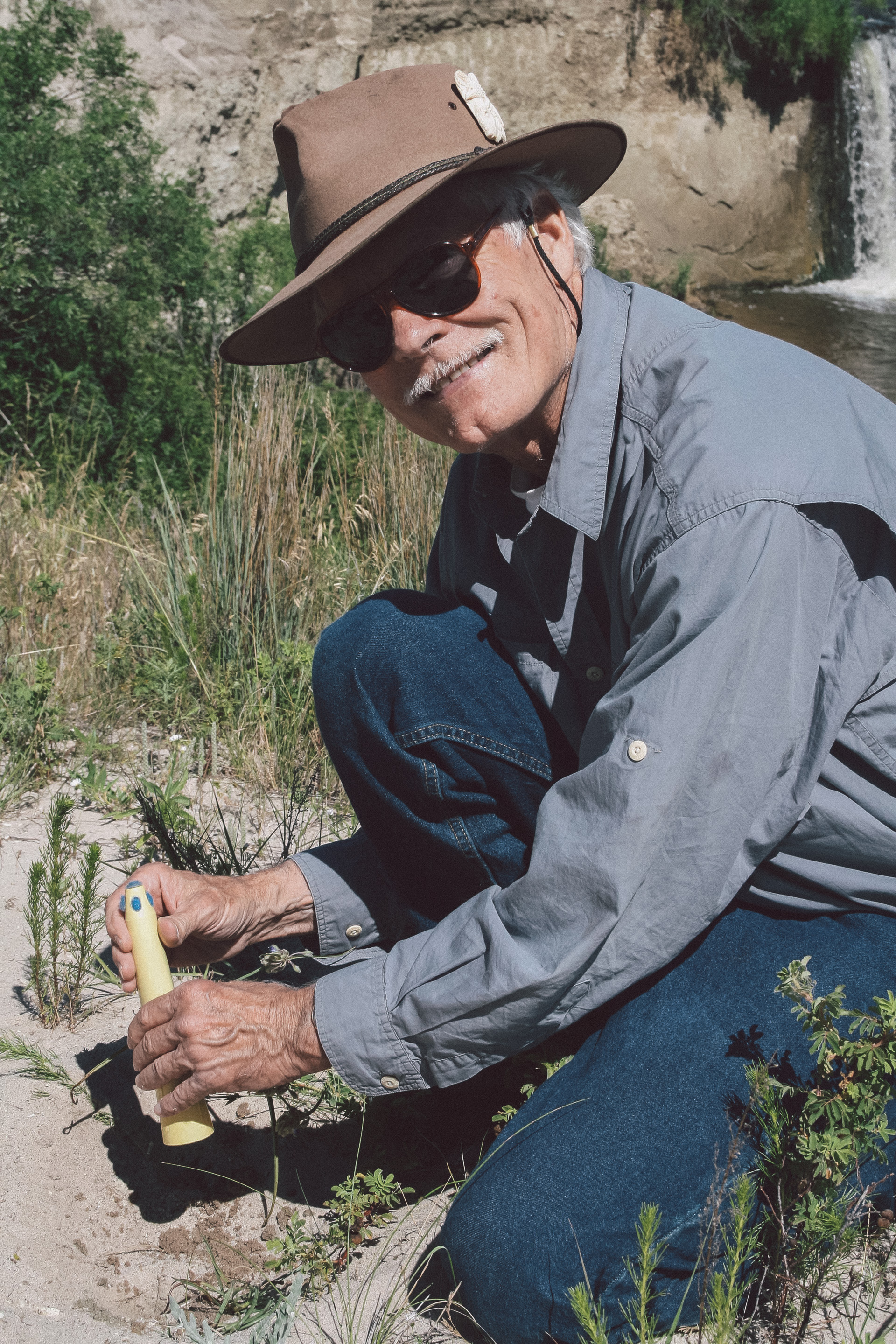 Ted Turner planting penstemon seedlings on the Spike Box