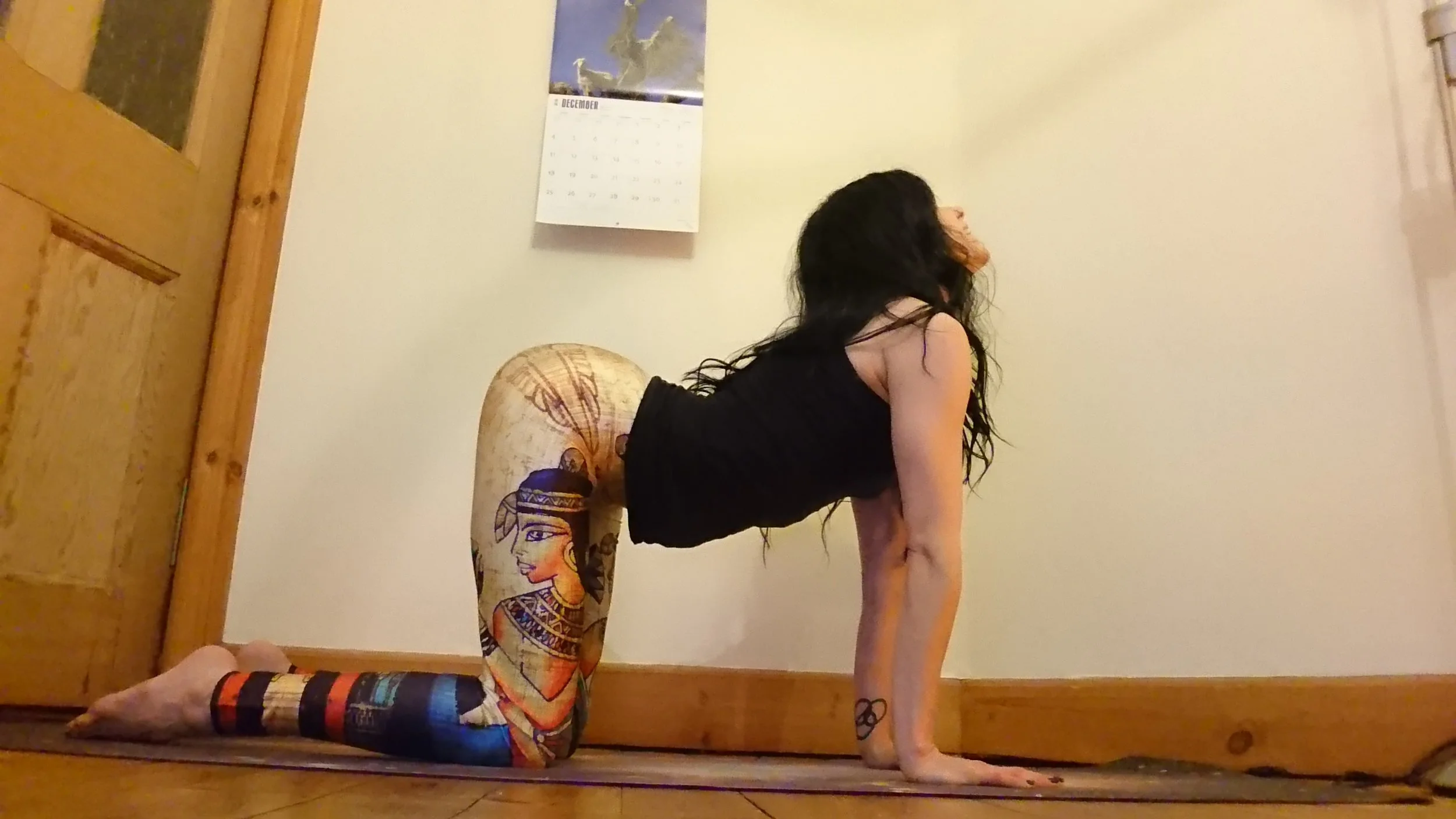 On an inhalation, start to point your tailbone up towards the sky and look up, dropping your navel towards the ground.
