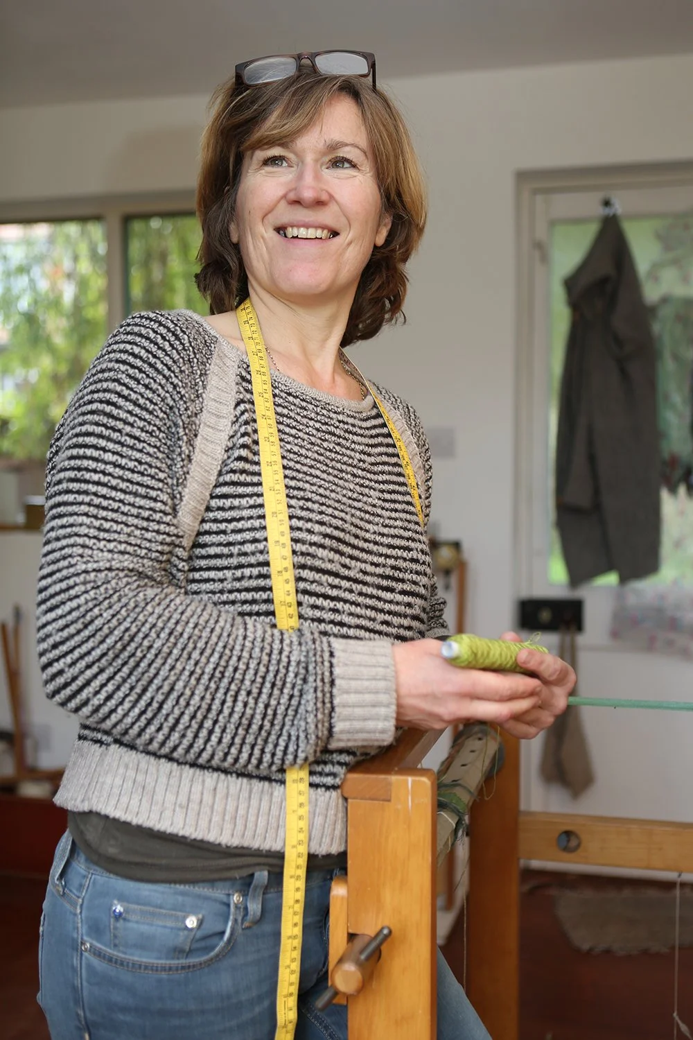  Carolyn Abbott    Carolyn is a Weaver working in Walthamstow, East London. Her unique hand woven fabrics are made into cushions and scarfs which are stocked in stores all over the UK. 