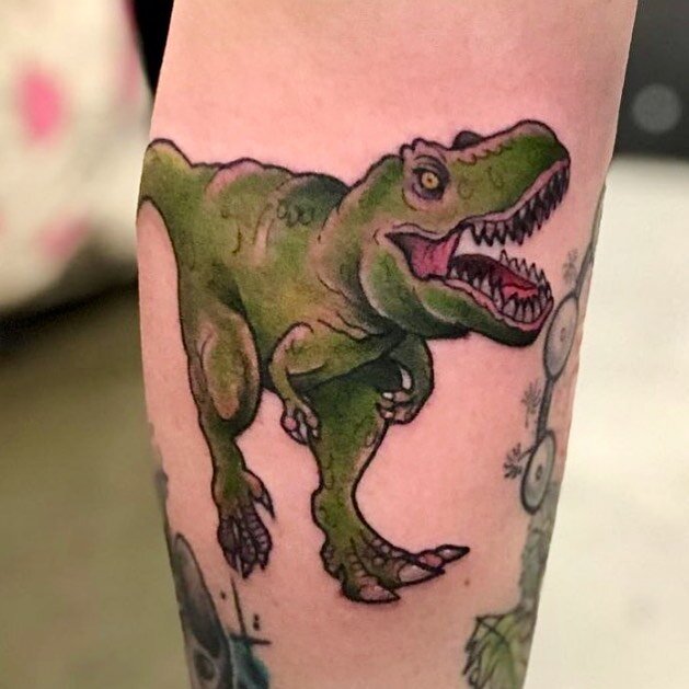 Have you watched #prehistoricplanet yet? Here&rsquo;s an old one that is dinomite 🦖 tattoosbyloorin@gmail.com for appointments 
.
.
.
.
#trex #trextattoo #ladytattooers #conventiontattoo #dinosaurtattoo #torontotattoos #womenwithtattoos #tattoosofin