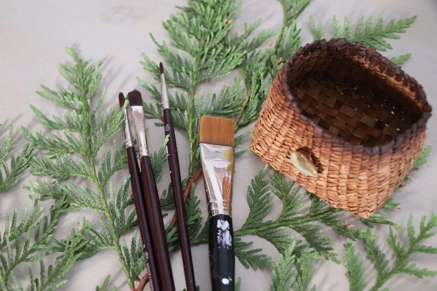 Cedar bows and cedar basket with paint brushes