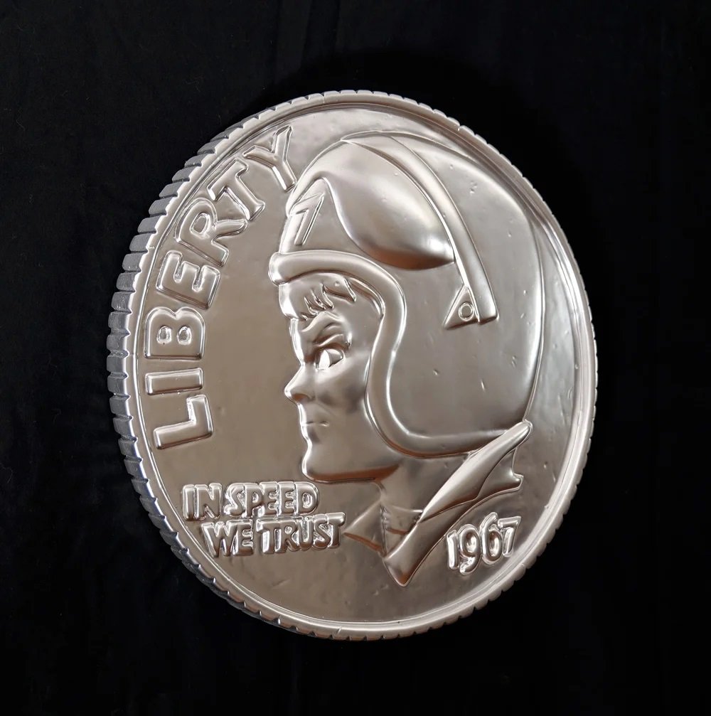    In Speed We Trust    A companion piece to the “What if I chose the Presidents” series. This time, the Eisenhower dime.  Ceramic &amp; Enamel; 15”W x 1.25”D; wall-hanging. Limited Edition made-to-order from the original mold. E-mail for pricing, av