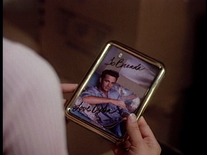 Dylan’s awkwardly signed (with rather feminine handwriting) glamour shot…