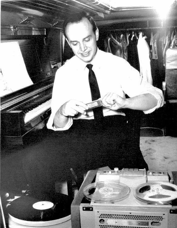 Practicing piano inside The Roger Williams Tour Bus