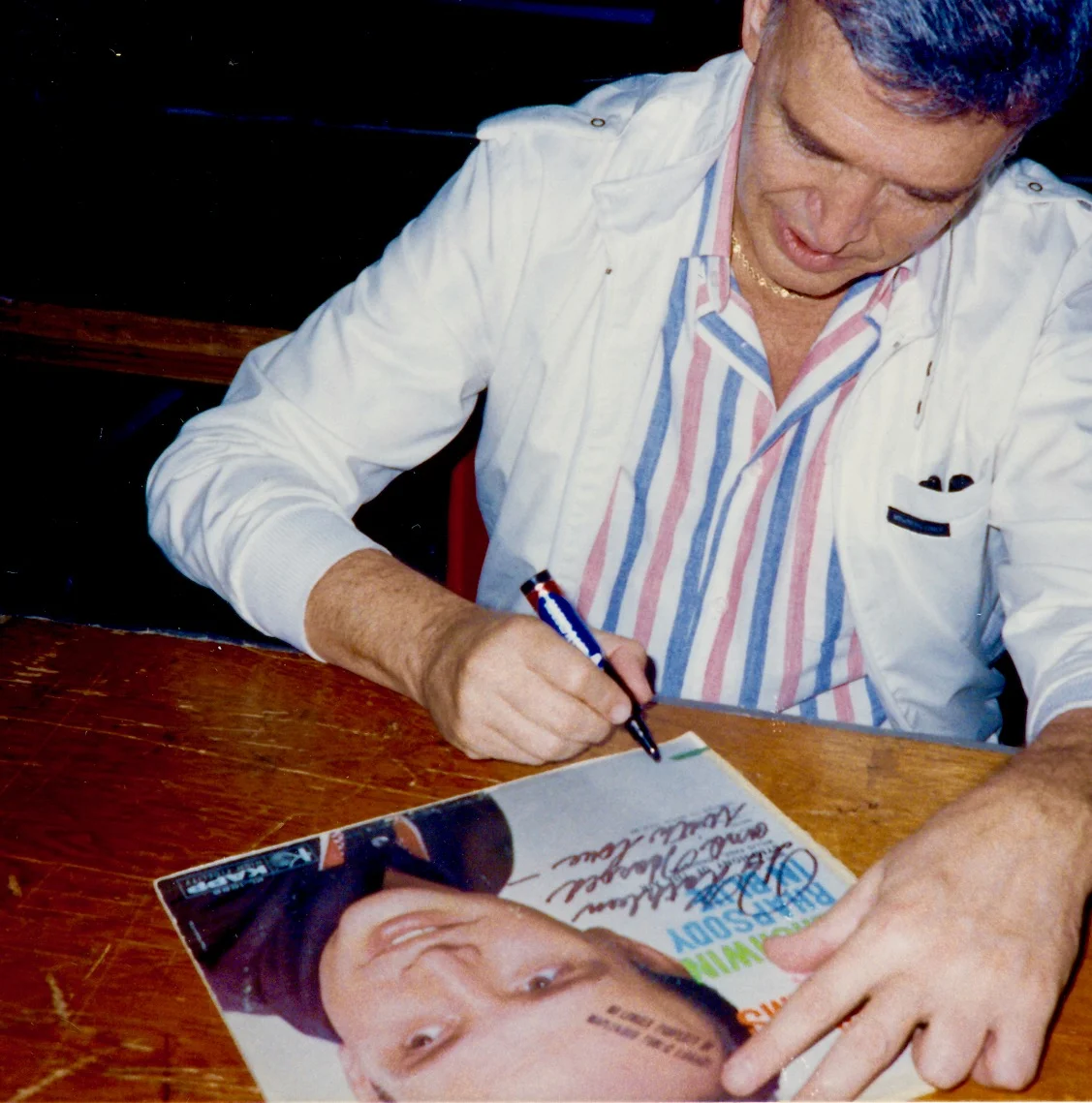 Roger signing autographs