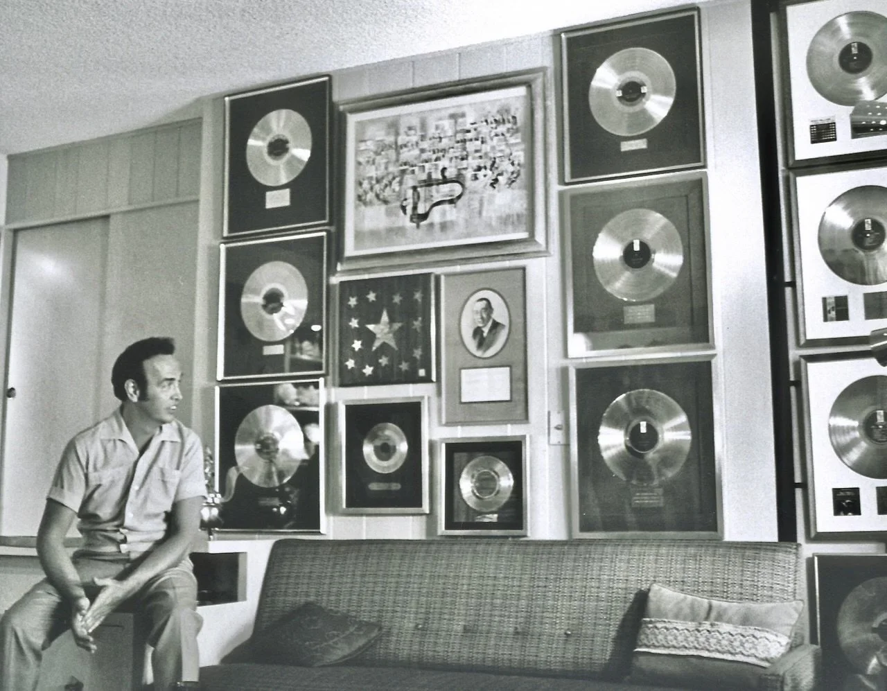Roger beside some of his gold records
