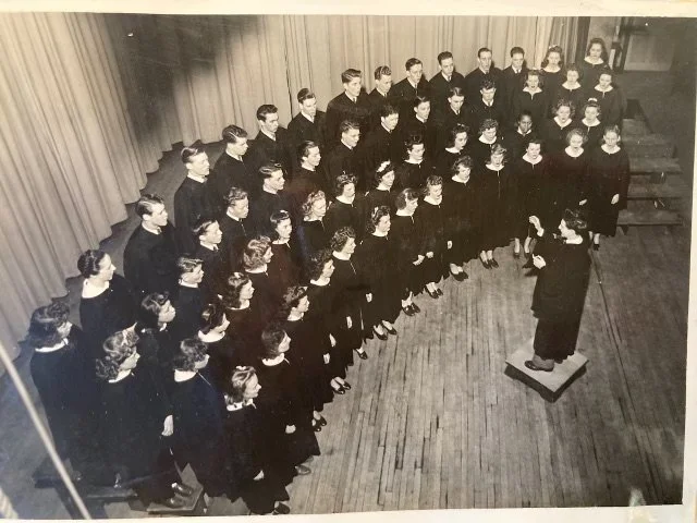 Roger conducts the choir at his father's church 