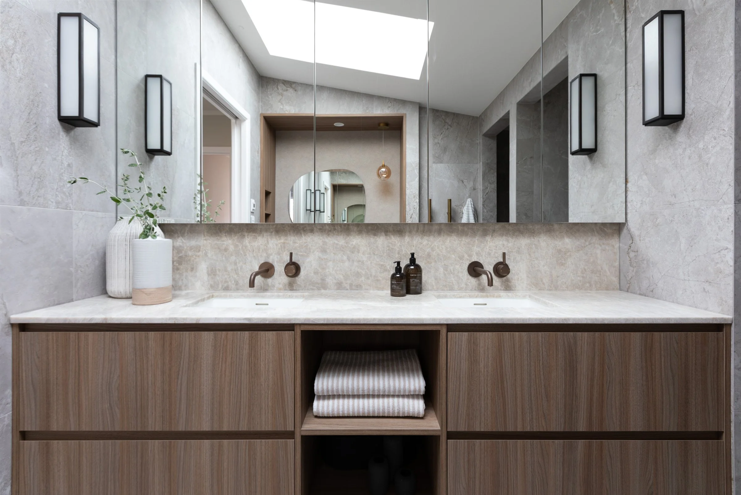 Luxury Ensuite with wall to wall mirror and vanity