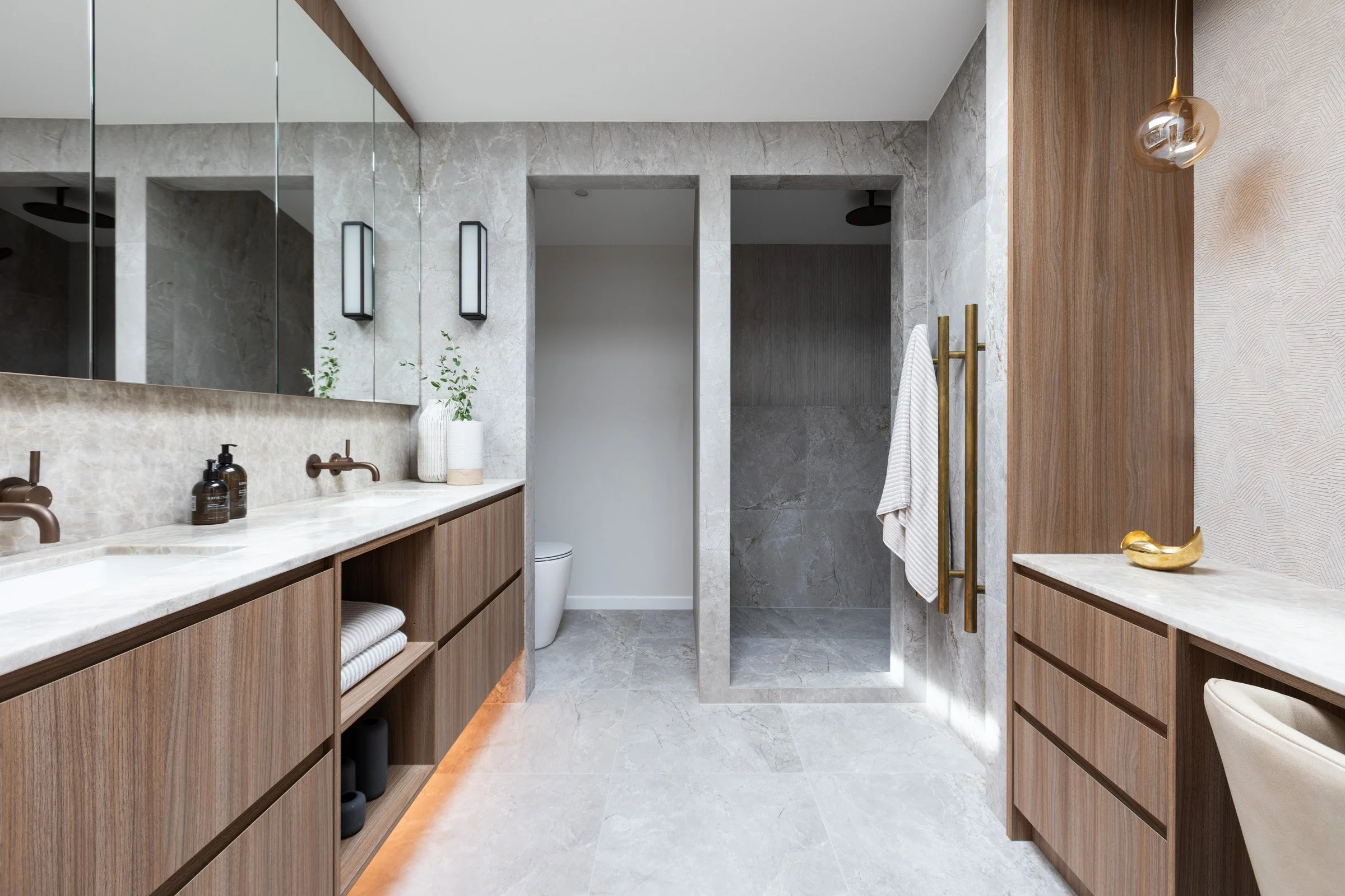 Full image of ensuite with custom cabinetry 