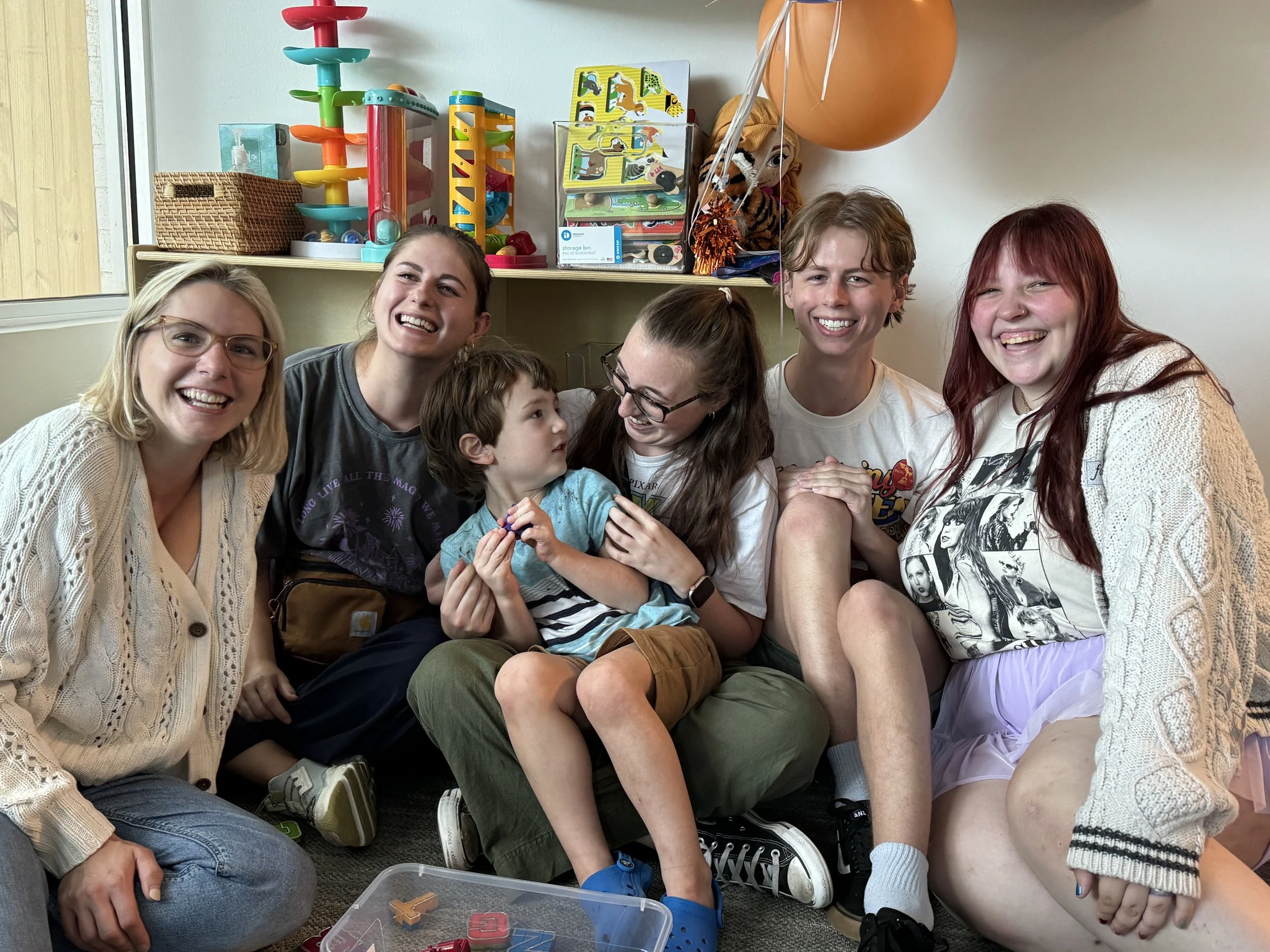  My son on his graduation day at ABA with his BCBA and RBTs 