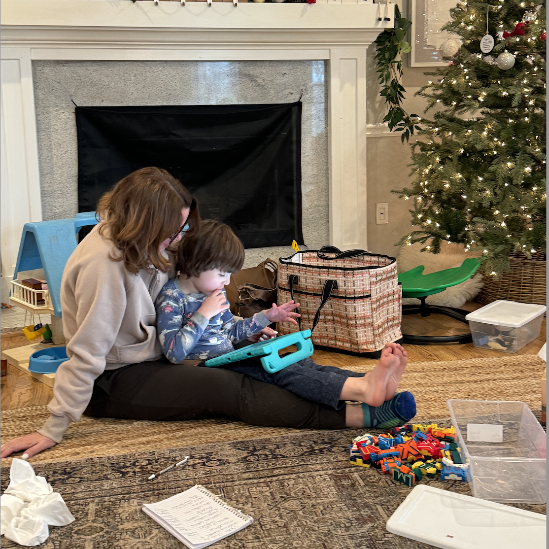  My son with his speech therapist working on an AAC device 