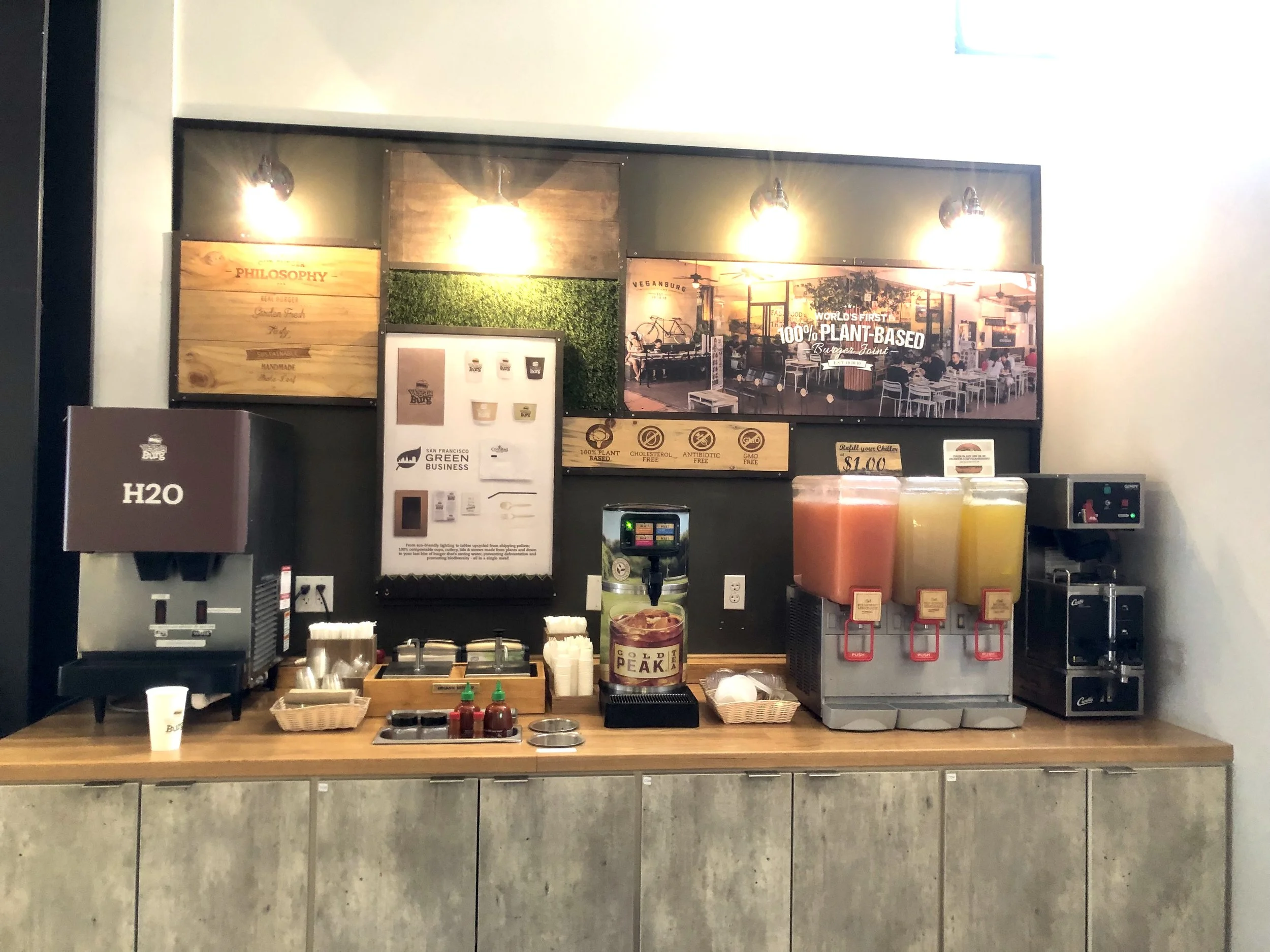 The beverage & condiment bar. They have three different lemonades to choose from. Bottled beverages are available at the front.