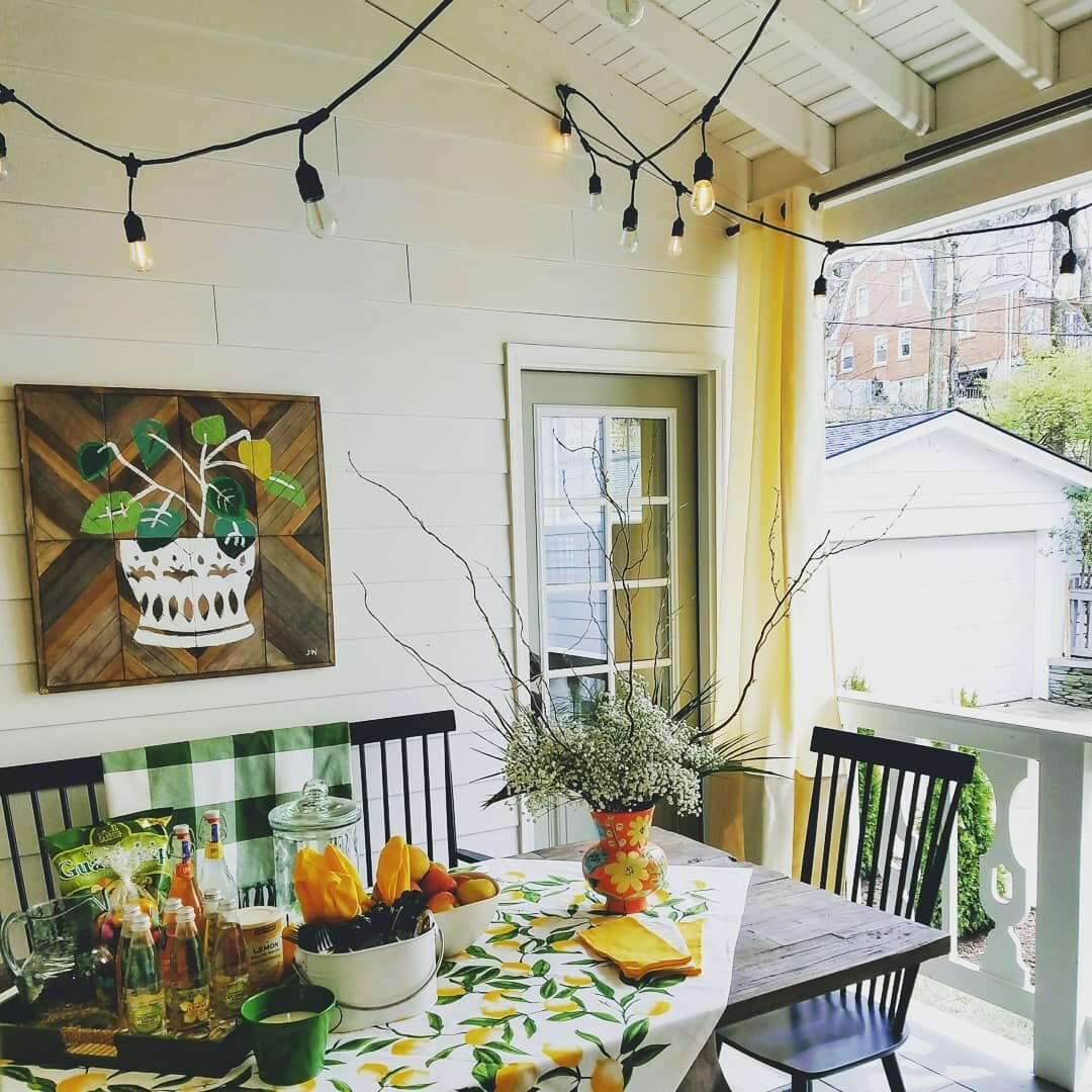 How amazing is this covered courtyard? This home was a rehab from a few years ago. We added a first floor master which formed this covered space sandwiched between the master and the kitchen. The painting is a wooden wall hanging I bought from Hobby 